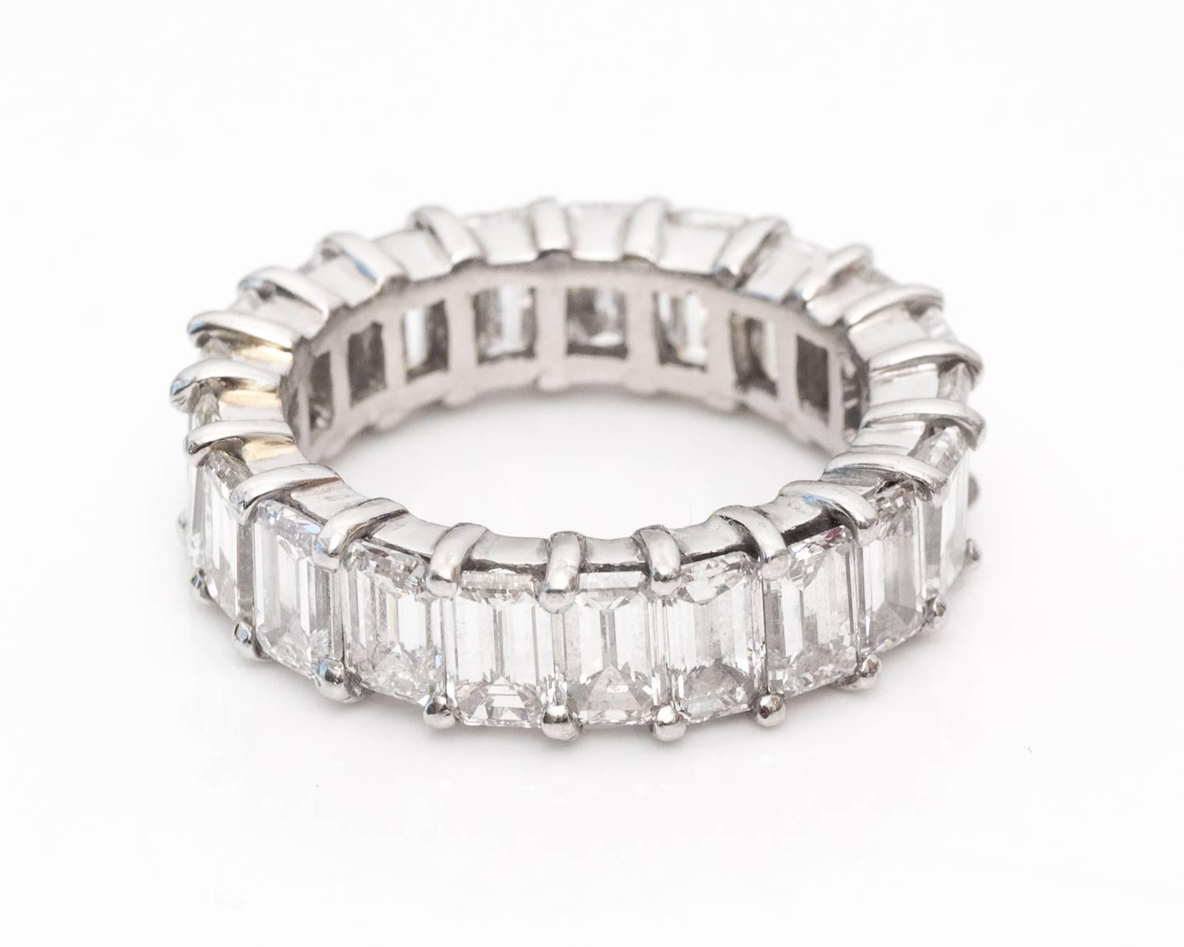 10 Carat Diamond Eternity Band, Platinum Crafted
Emerald Cut Diamonds
H Color, VS Clarity 
All Prong Set Diamonds
Fits Ring Size 8.25
The diamonds can be set into a new style setting and can be made to most sizes.

5.5 millimeter x 3.8 millimeter