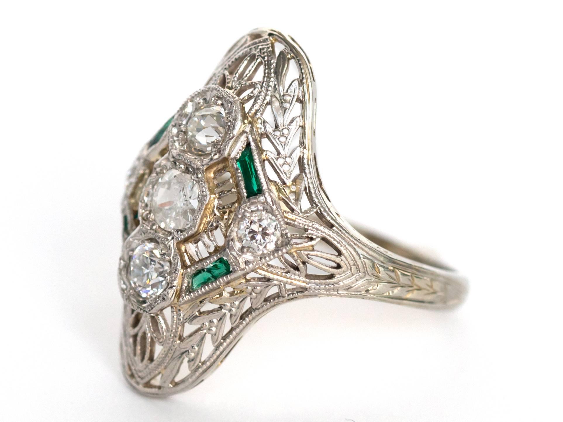 Item Details: 
Ring Size: 5.5
Metal Type: Platinum
Weight: 3.6 grams

Diamond Details
Shape: Old European Diamond
Carat Weight: .50 Carat, total weight 
Color: F
Clarity: VS

Color Stone Details: 
Type: Natural Emerald
Shape: French Cut
Carat Weigh: