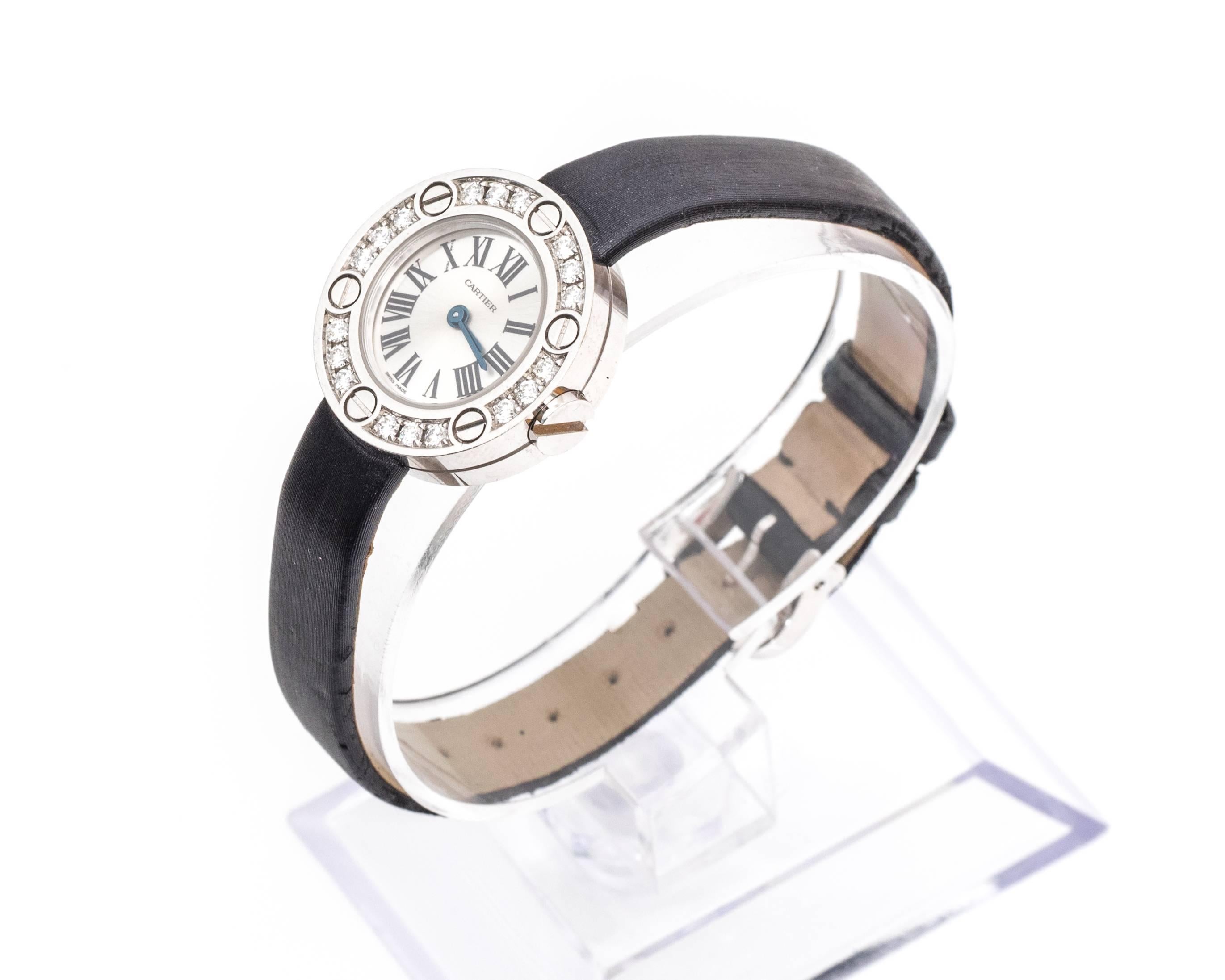 Cartier Wristwatch, part of the Love series
18 Karat Gold and Diamonds
Black Leather Strap (condition is mint, and can be replaced to a new strap) 
Model Number WE800331
Features 18 Diamonds along Frame of Dial with Cartier logo separating each