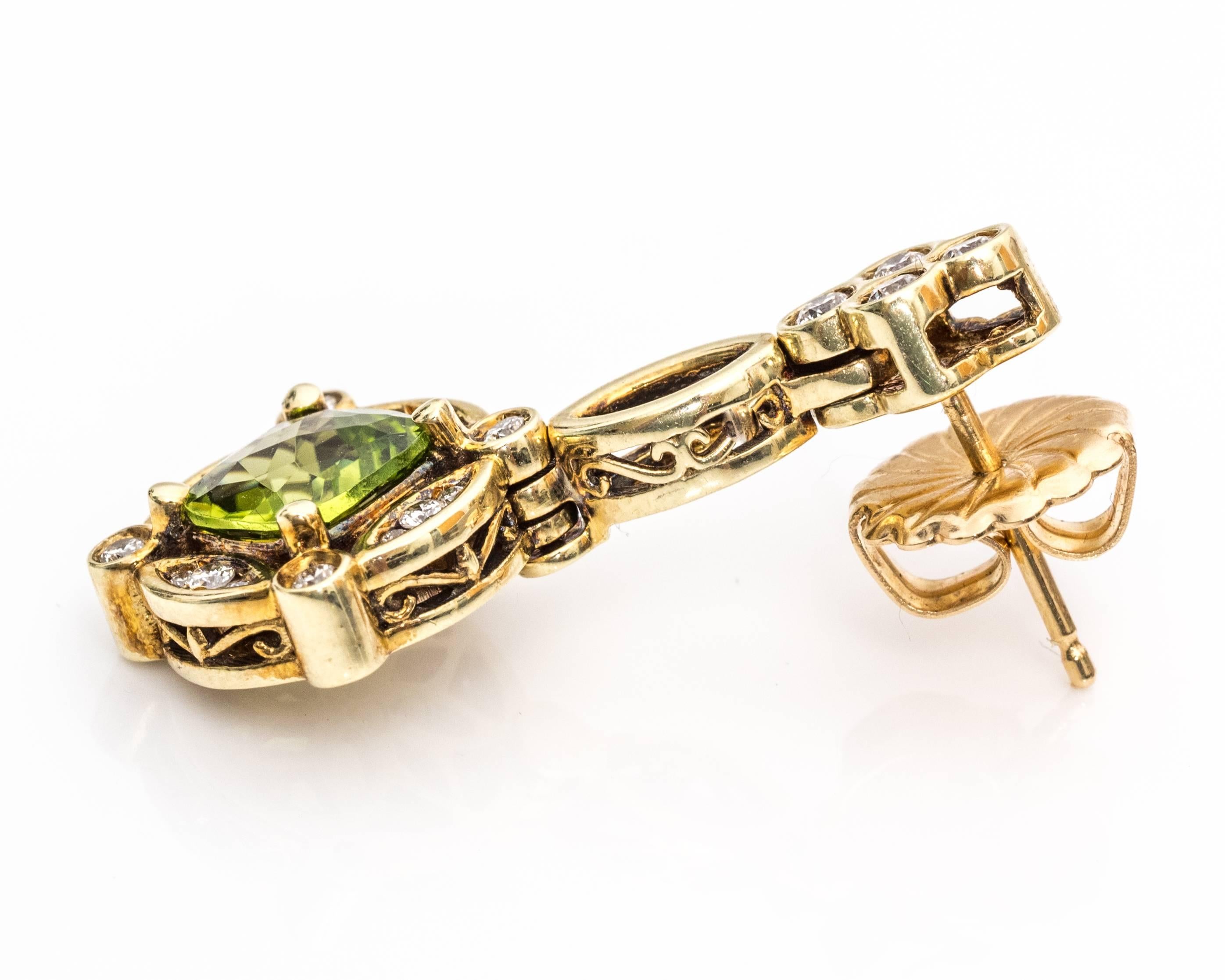 1950s Chandelier Earrings - 14 Karat Yellow Gold, Peridot, Diamonds

The center peridot stones are 1 carat each (2 carat total weight) with a cushion shape. At each corner of the peridot, there is a diamond set in a bezel frame. Between these four