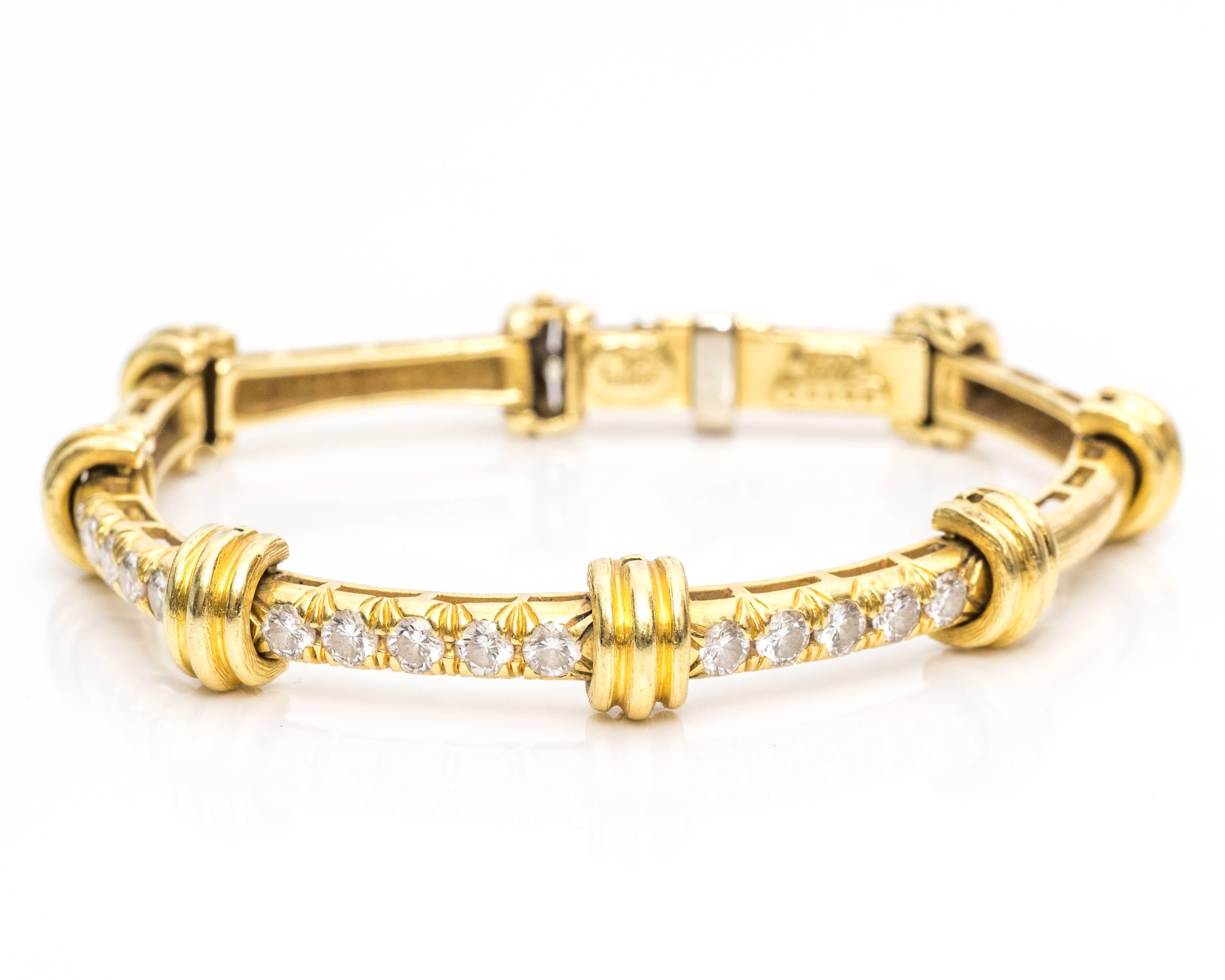 Dunay Bracelet from 1990s
Frame is bamboo inspired pattern along each chain link.
Features Diamonds on three front chain links.
Total of 15 Diamonds, measuring 2 carats total 
Small Gallery Underneath Each Link
Crafted in 18 Karat Yellow Gold
The