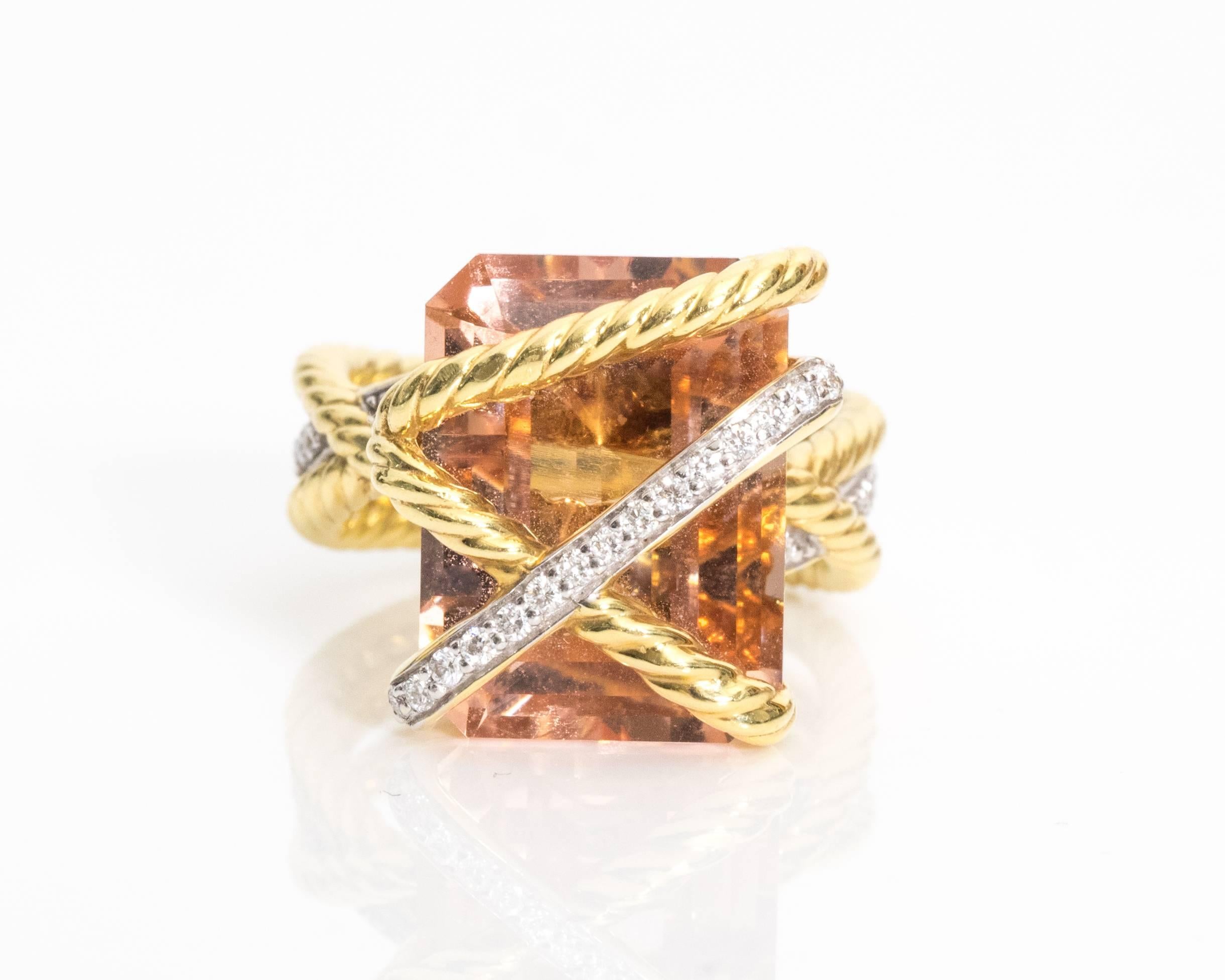 This authentic David Yurman ring has a 16 x 12 millimeter morganite center stone. This piece retails for over $4,000 currently.
Pre-Owned
Great Condition
Features three distinct braided rows - two are made of 18 karat yellow gold and the other has a