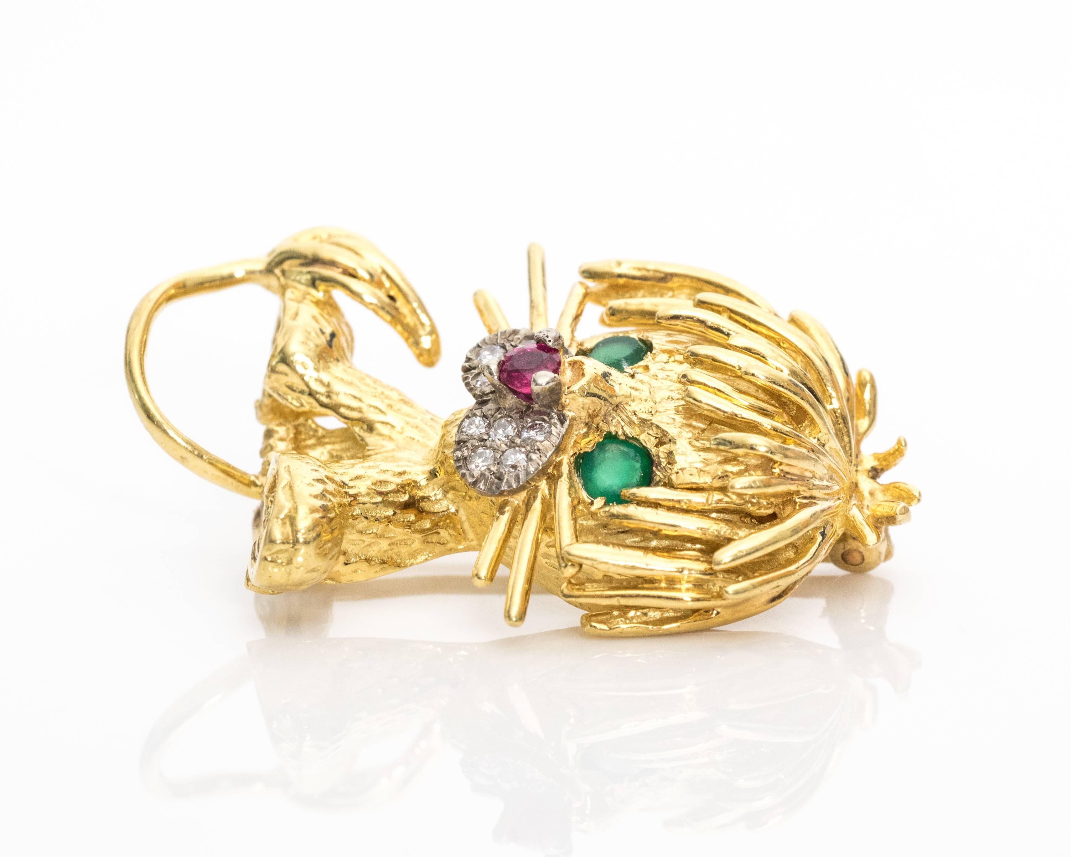 1950s Retro French Lion Brooch with 18 Karat Yellow Gold, Diamonds, Emeralds, Ruby. Features Emerald eyes, Ruby nose and Diamond muzzle with textured 18K gold body, mane, face, tail and whiskers. Ruby and diamonds are prong set. 
This exquisitely