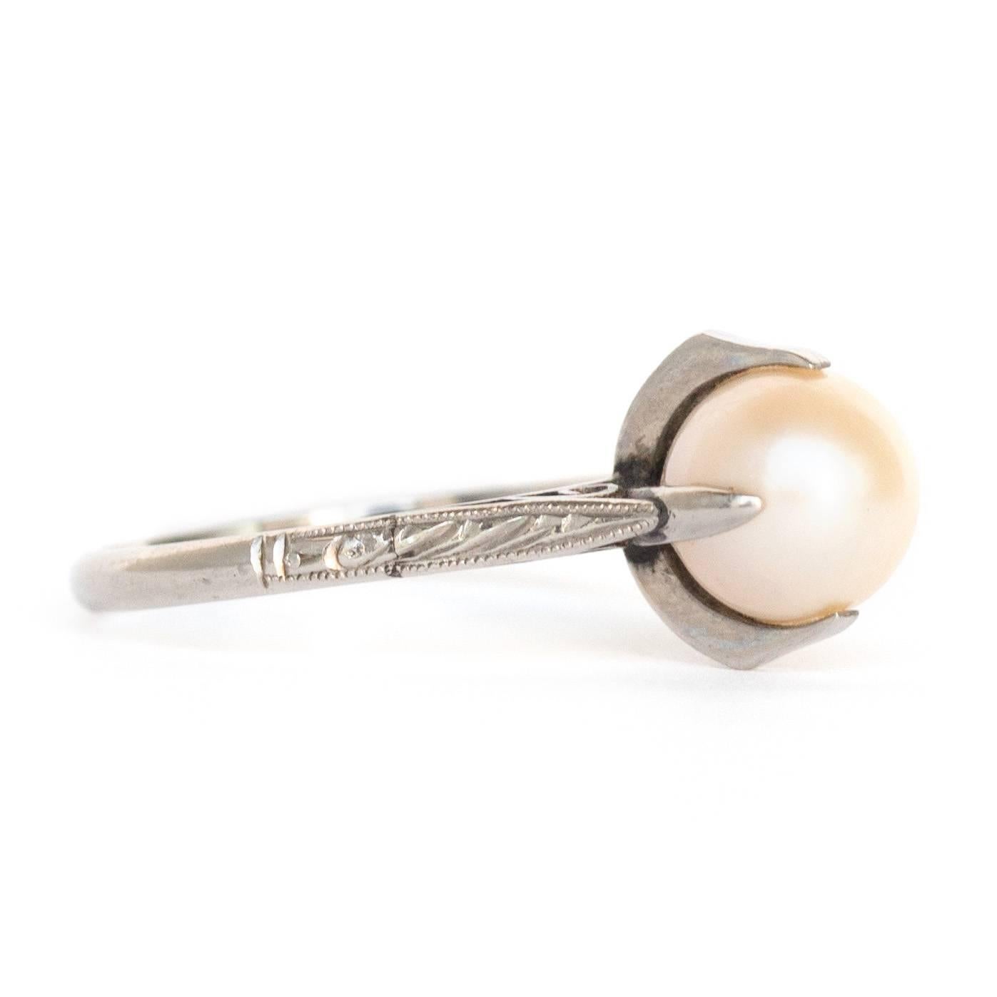Item Details: 
Ring Size: 7.5
Metal Type: Platinum
Weight: 2 grams

Pearl Details: 
Type: Pearl
Shape: Natural
Carat Weight: 2 Carat, total weight.
Quality: AAA+ Luster

Finger to Top of Stone Measurement: 10mm