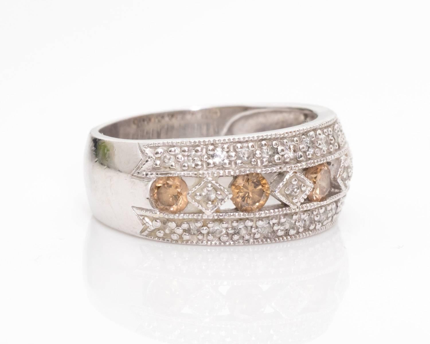 Beautiful Ring featuring White and Brown Diamonds dating to 1970s
Ring features Triple Row of Sparkling Diamonds 
Middle Row has alternating White and Brown Diamonds for Extra Color
Brown Diamonds are Channel set
White diamonds are inlayed in Bezel