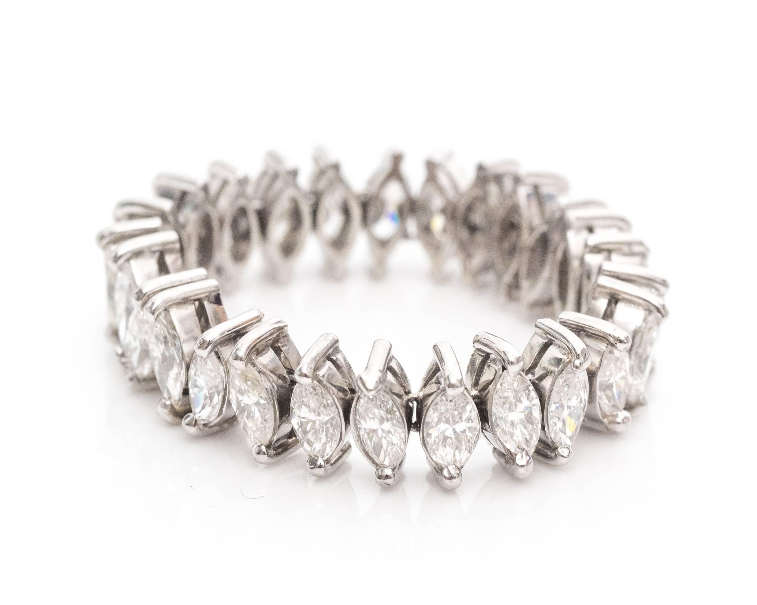 1950s Platinum 3 carats Marquise Diamond Eternity Band Ring

These beaming marquise shaped diamonds total to 3 carats. They are mounted in two-prong frames that protect the tip of each cut. The entire frame is made of platinum.

This linked ring is