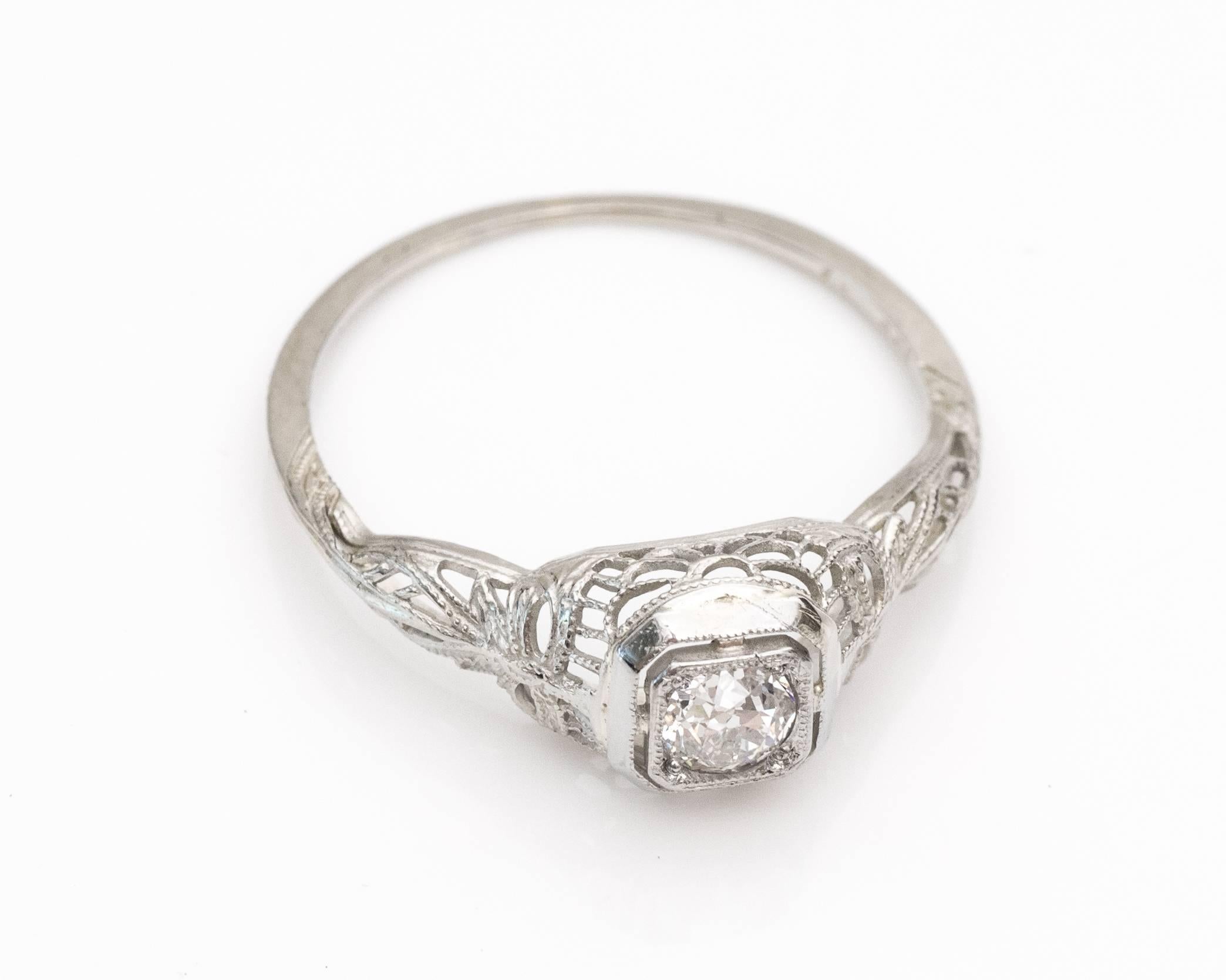 1925 Art Deco .25 Carat Old Mine Diamond 18 Karat White Gold Engagement Ring. This filigree ring remains in amazing condition! The shine and detail of this piece makes it a true gem. The metalwork was handcrafted in 1925 with sincere attention and