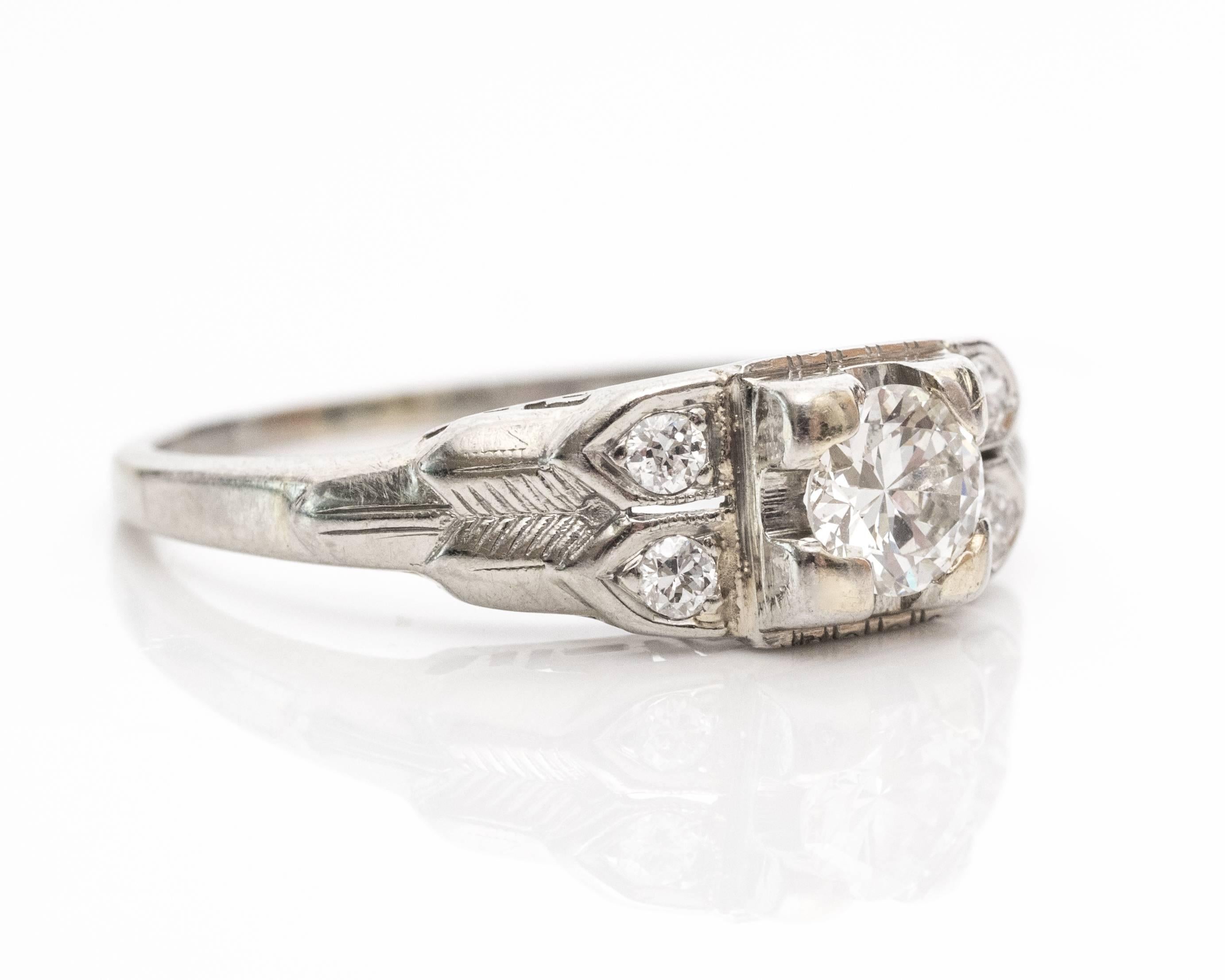 1930s Art Deco Old European Diamond white gold Engagement Ring. This beautiful ring has five sparkling diamonds inside a 18 karat white gold frame. The center Old European cut diamond is .30 carat with a fishtail prong setting. There are two single