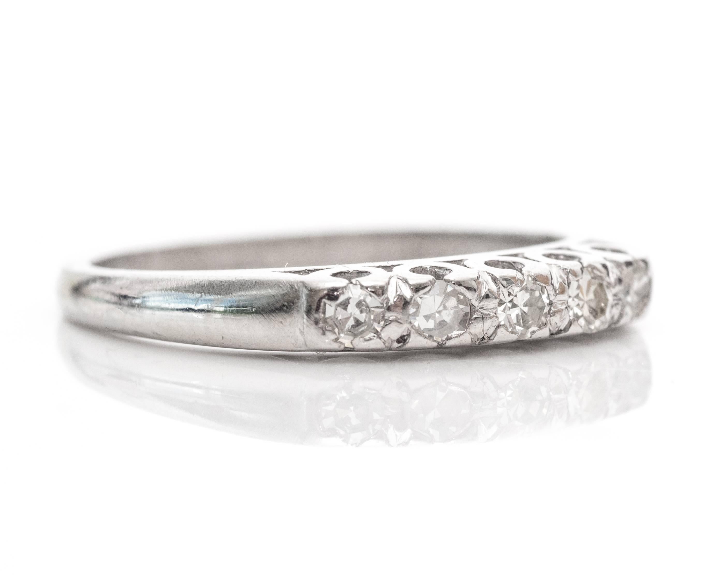 1920s Art Deco .10 Carat Diamond Platinum Wedding Band. This band is sparkling with a total of 5 diamonds along the front frame. The single cut diamonds total to .10carat. The stones are embedded in bezel frames with the sides visible underneath the