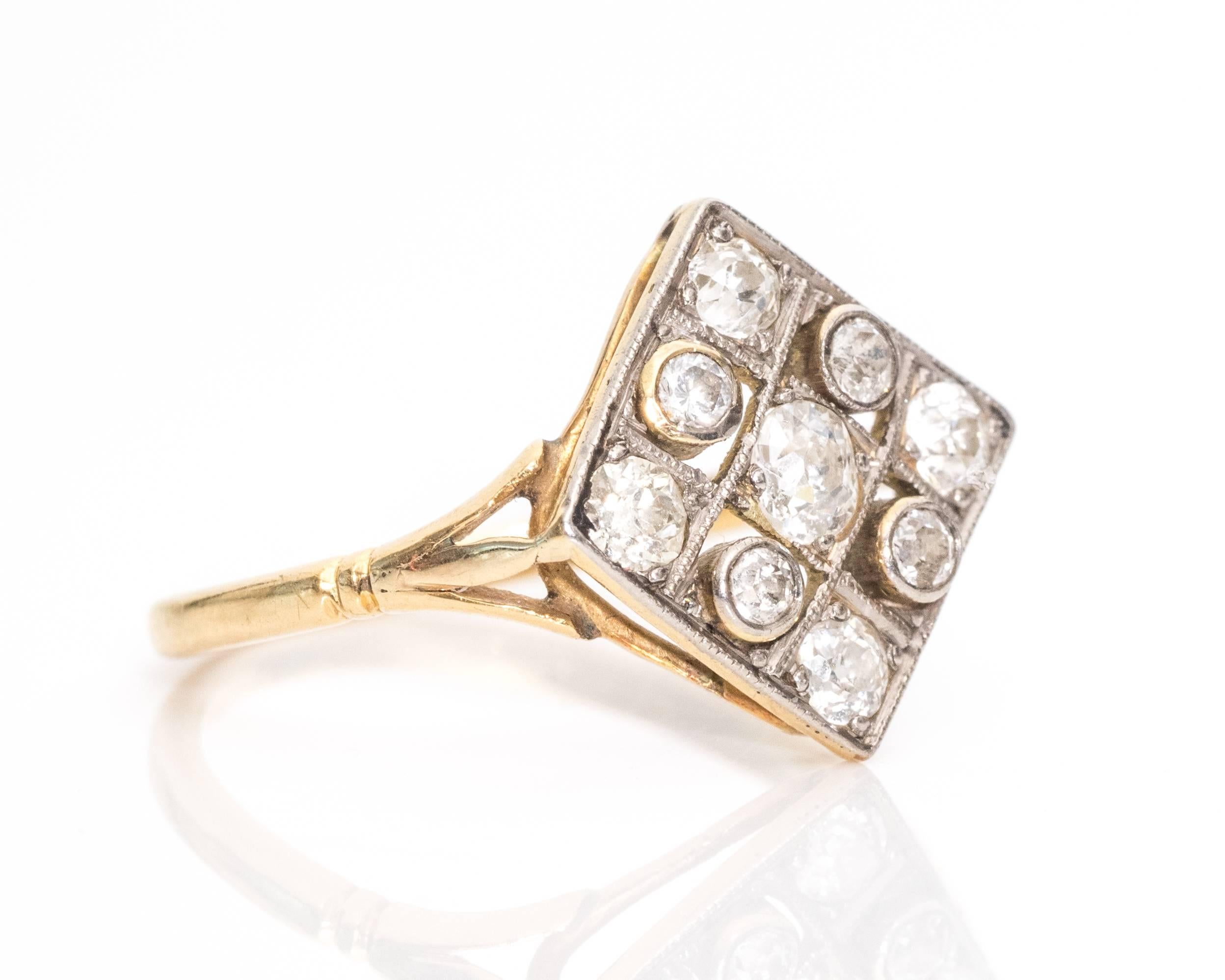 1915 Edwardian .60 Carat Old Mine Diamond, Platinum, 18 Karat Gold Ring features 9 diamonds in a square set frame. The middle and corner diamonds are Old Miners set in four-prong frames. The four single cut diamonds in between are set in bezel