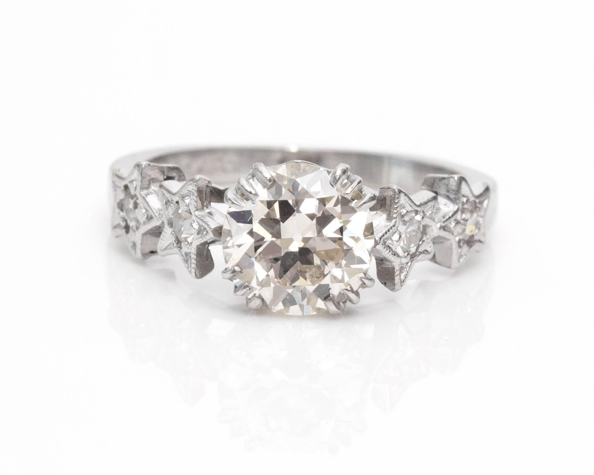 1920s Art Deco 1.53 Carat GIA Certified Diamond Platinum Engagement Ring. A rare and original piece is unique due to the four star-shaped accents on the shoulders of this ring. The center diamond is an Old European cut 1.53 carat diamond with GIA