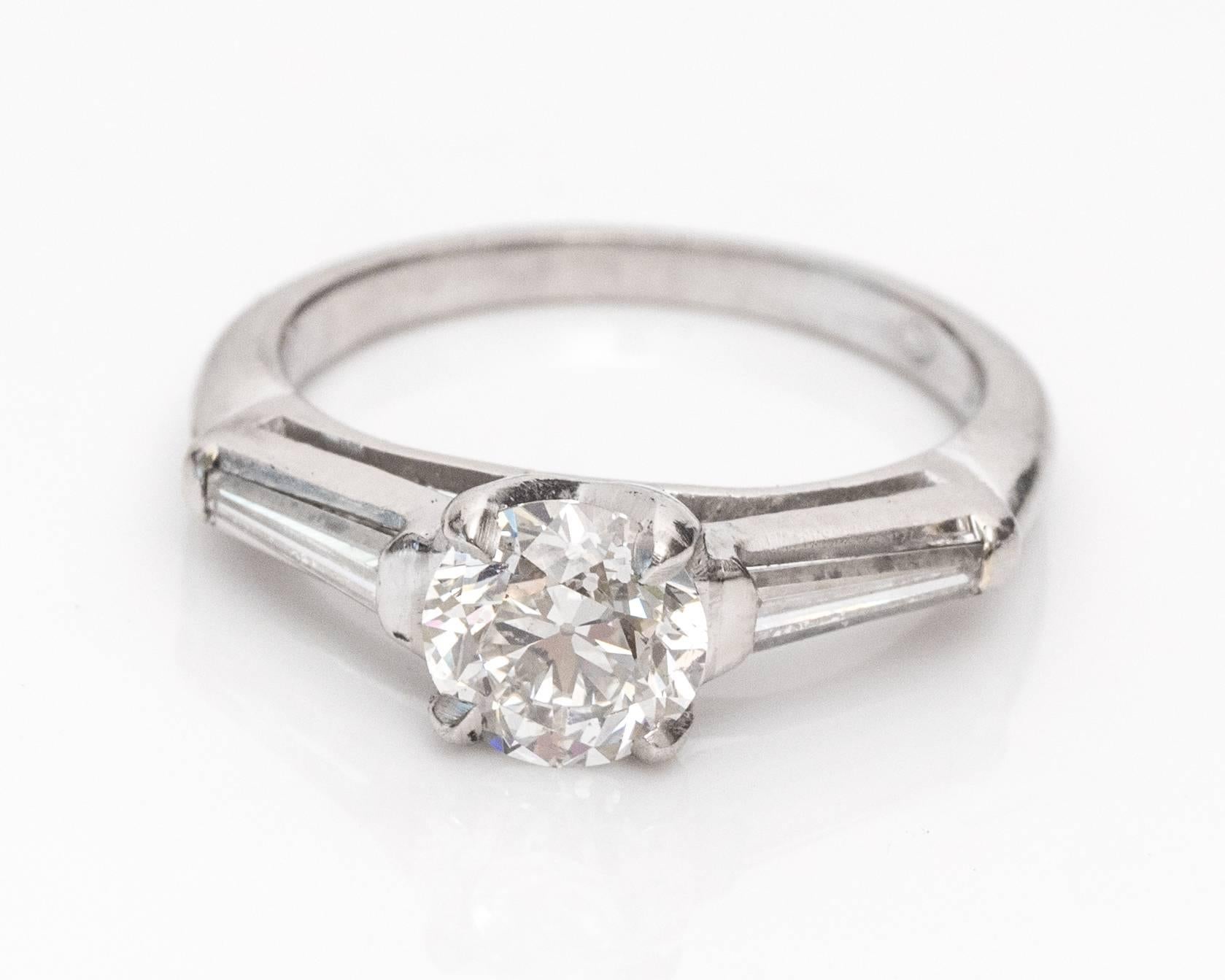 This ring shines with simplicity and sophistication. The timeless style will last through the ages, just as it already has! This 1925 ring has a GIA certified center diamond with an Old European shape and .87 carat weight. The diamond is set in a