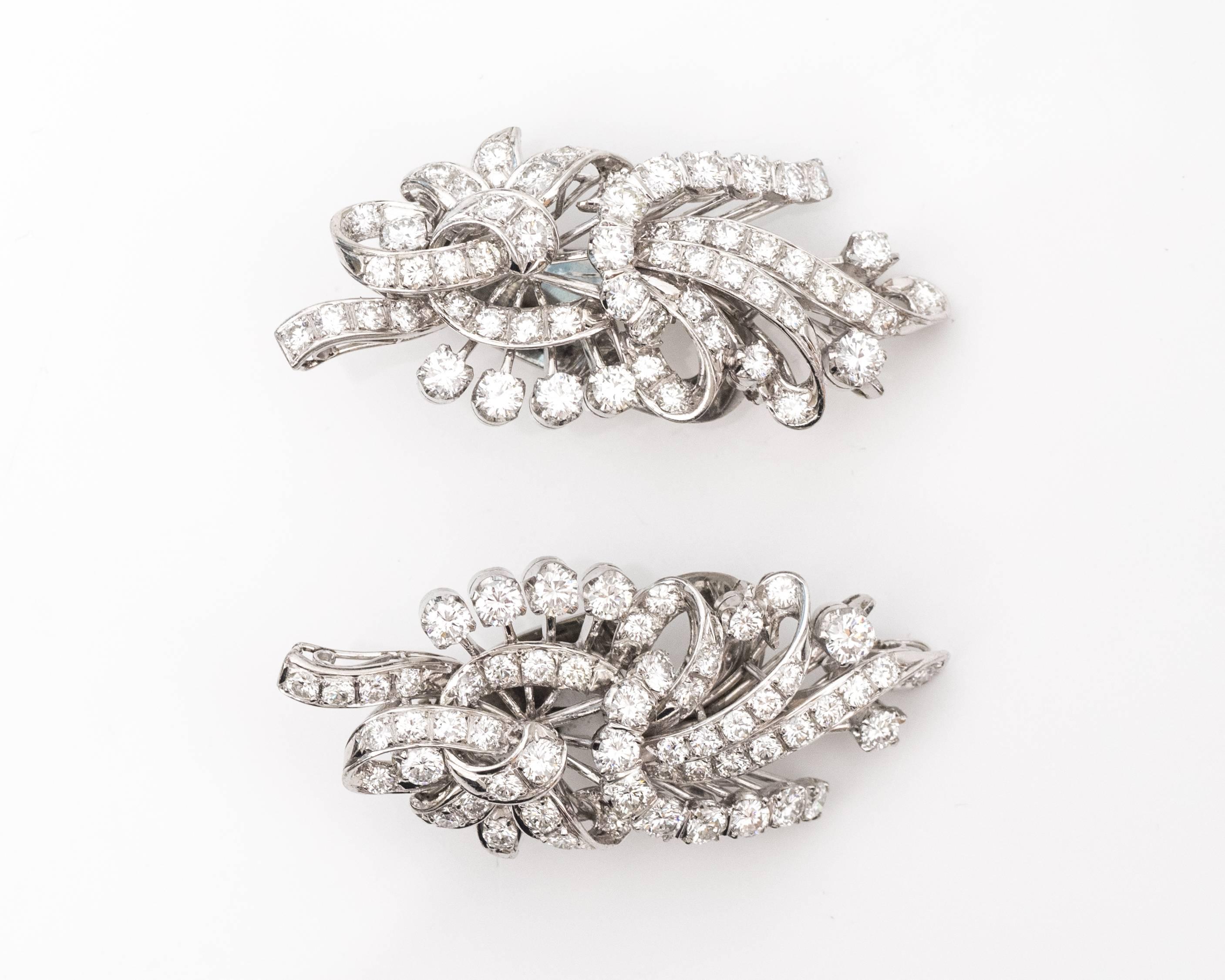 1950s Retro Diamond Platinum Earrings feature 6.0 carat total weight Diamonds set in Platinum. Omega lever backs provide extra security, stability and wearing comfort. The earrings measure 1.7 inches long x .75 inches wide.

 These over-the-top