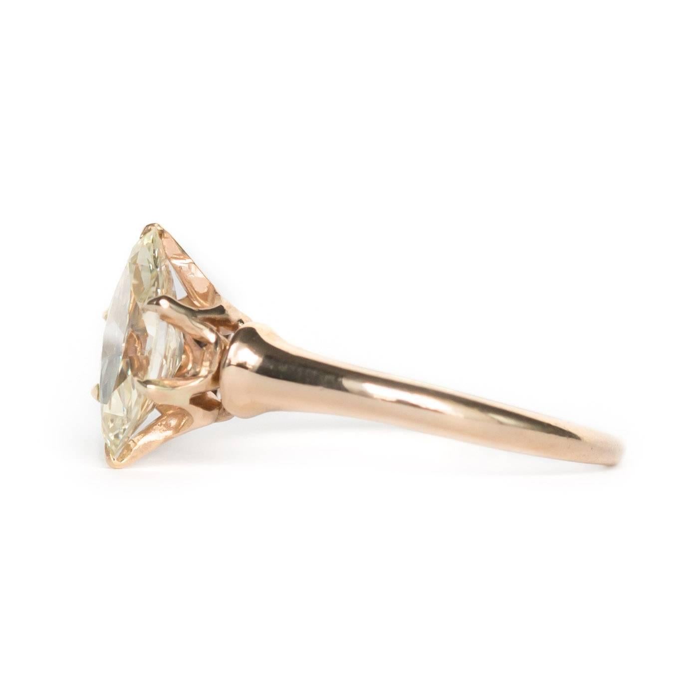 Item Details: 
Ring Size: 6.25
Metal Type: 9 Karat Yellow Gold
Weight: 2.1 grams

Center Diamond Details
Shape: Antique Marquise Cut
Carat Weight: 1.11carat
Color: Light Yellow
Clarity: VS

Finger to Top of Stone Measurement: 5.66mm
