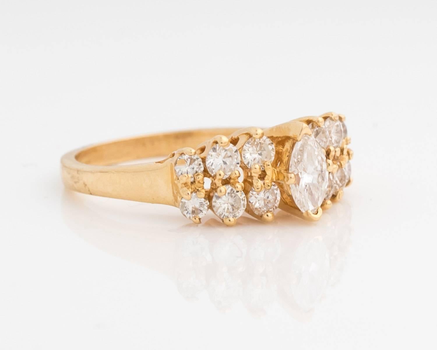 Gorgeous sparkling diamond ring band from the 1980s.
The natural diamonds are still in magnificent condition just like the rest of the ring! The center stone is a distinct marquise cut with six round brilliant stones on each side, for a total of 13
