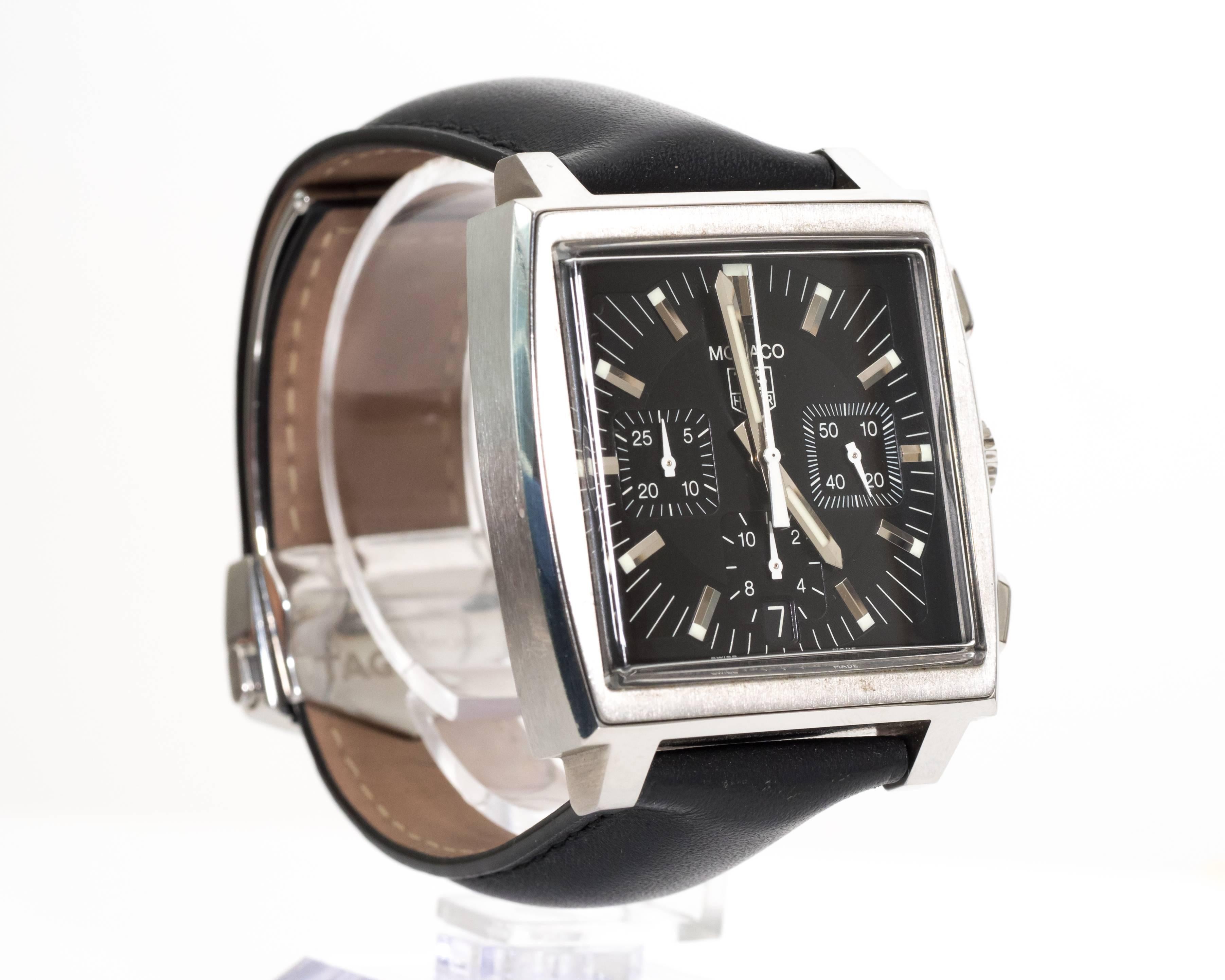 Late 2000s
Tag Heuer Monaco Wristwatch
Chronograph Automatic
Stainless Steel
Black Dial
Leather strap, Like New Condition. Features Deployment Clasp
Automatic Chronograph
#CW2111-0
Water Resistant, 30M

Hallmarked MONACO and Swissmade on Case Back 