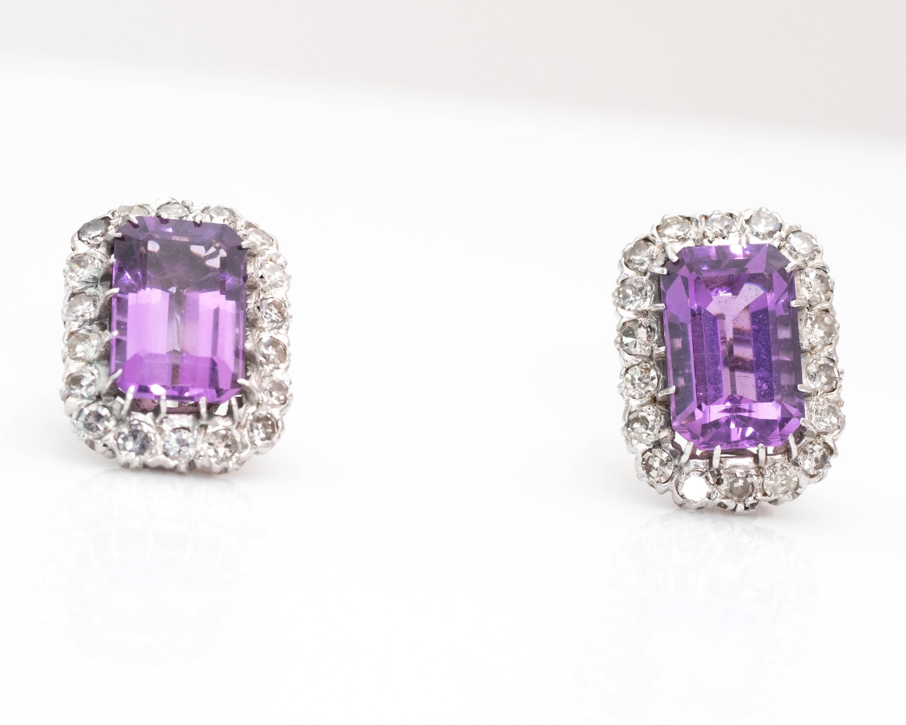 These timeless 1930s era intense, vivid purple amethyst and diamond in 14 karat white gold earrings exude sophistication. They feature an Omega back for added stability and security. 

Earring Details:
Metal: 14 karat white gold

Amethyst