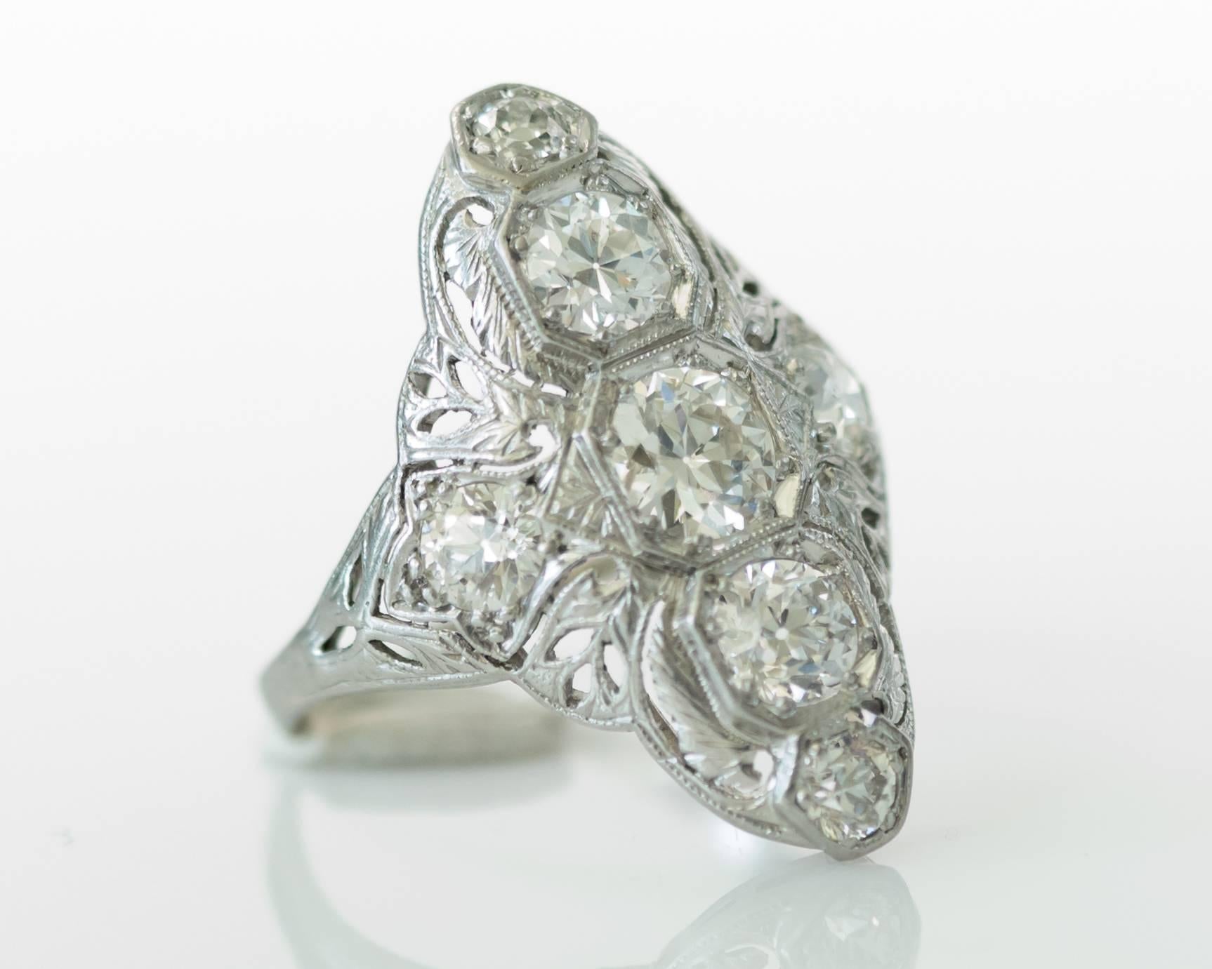 1930s Art Deco 2.06 Carat Diamond Platinum Shield Ring. Features Seven Diamonds and makes the perfect unique engagement ring! It is also a gorgeous cocktail ring! Wherever you wear it, this stunning seven diamond platinum ring is sure to turn heads.