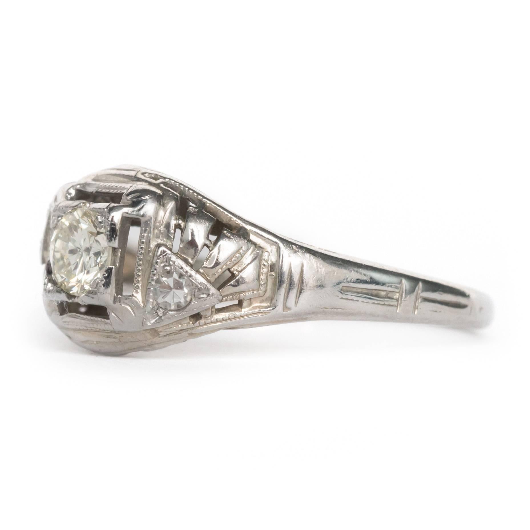 Item Details: 
Ring Size: 6.25
Metal Type: 18 Karat White Gold
Weight: 2.2 grams

Center Diamond Details:
Shape: Old European
Carat Weight: .20 carat
Color: L
Clarity: SI1

Side Stone Details: 
Shape: Antique Single Cut
Total Carat Weight: .04