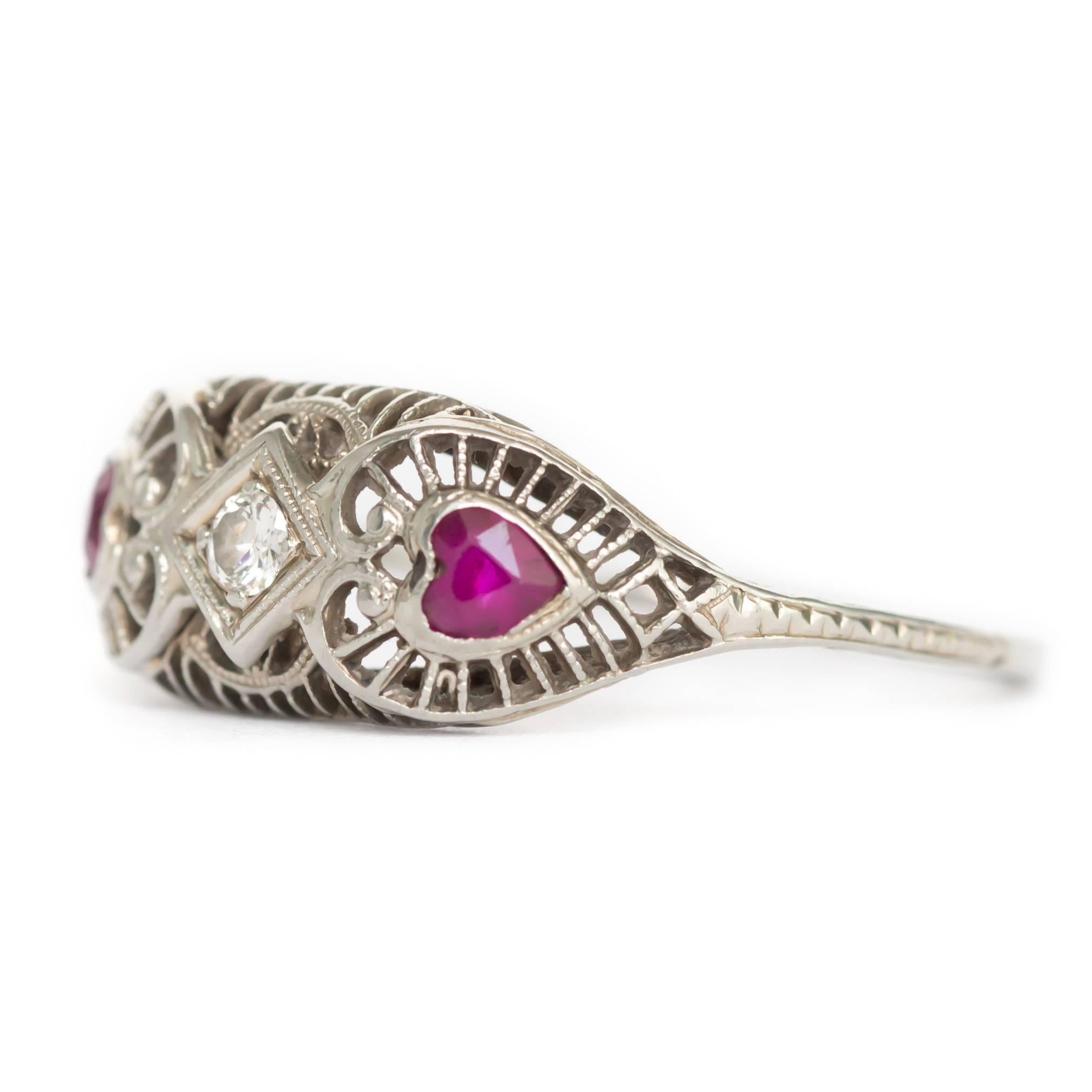 Item Details: 
Ring Size: Approx. 8.15
Metal Type: 18K White Gold
Weight: 2.0 grams

Center Diamond Details:
Shape: Old European
Carat Weight: .04ct
Color: G
Clarity: SI1

Color Stone Details: 
Type: Ruby
Shape: Heart
Carat Weight: .30ct, total