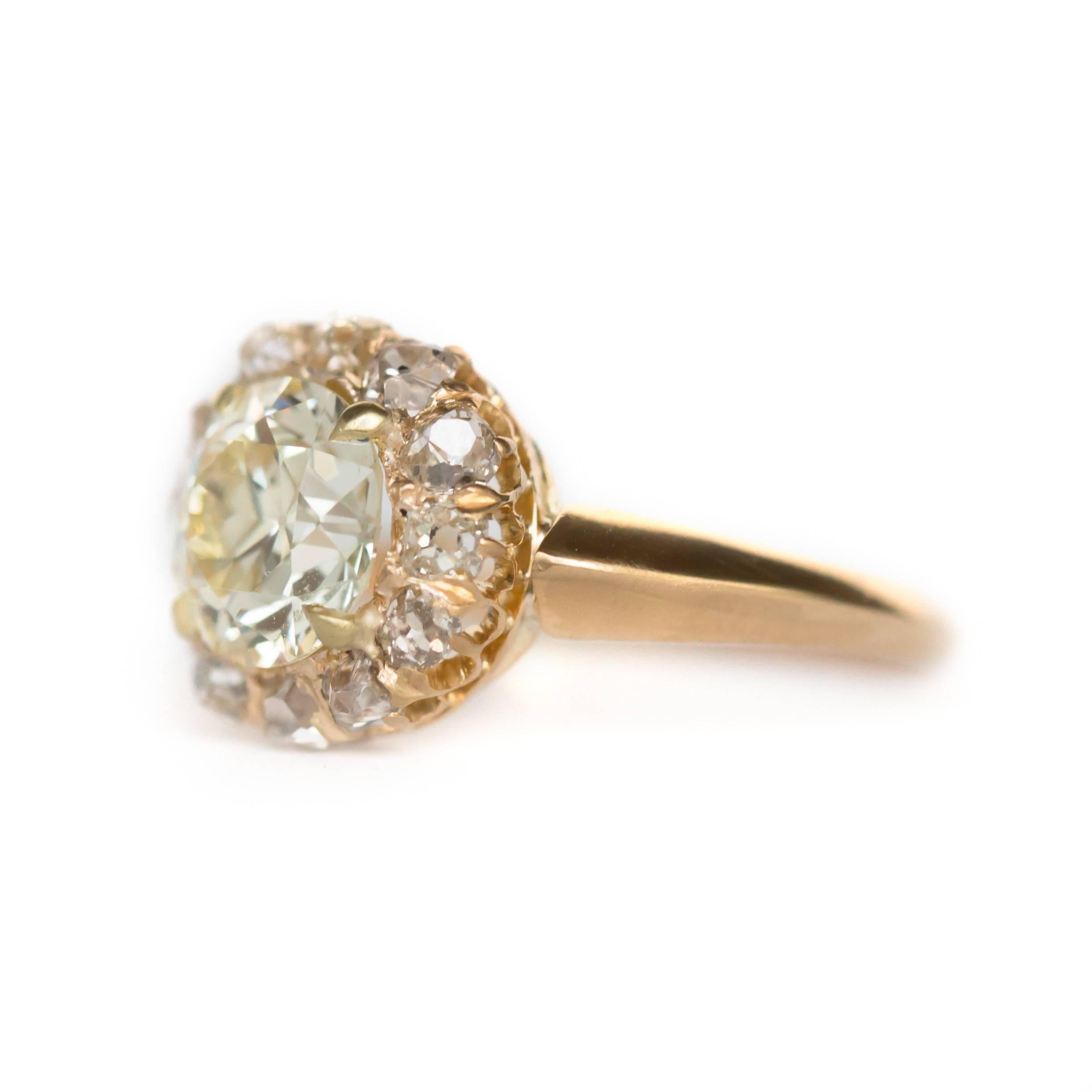 Item Details: 
Ring Size: Approximately 7.65
Metal Type: 14 Karat Yellow Gold
Weight: 3.7 grams

Center Diamond Details:
Shape: Old European
Carat Weight: 1.75 carat
Color: Fancy Light Yellow
Clarity: VS1

Side Stone Details: 
Shape: Old
