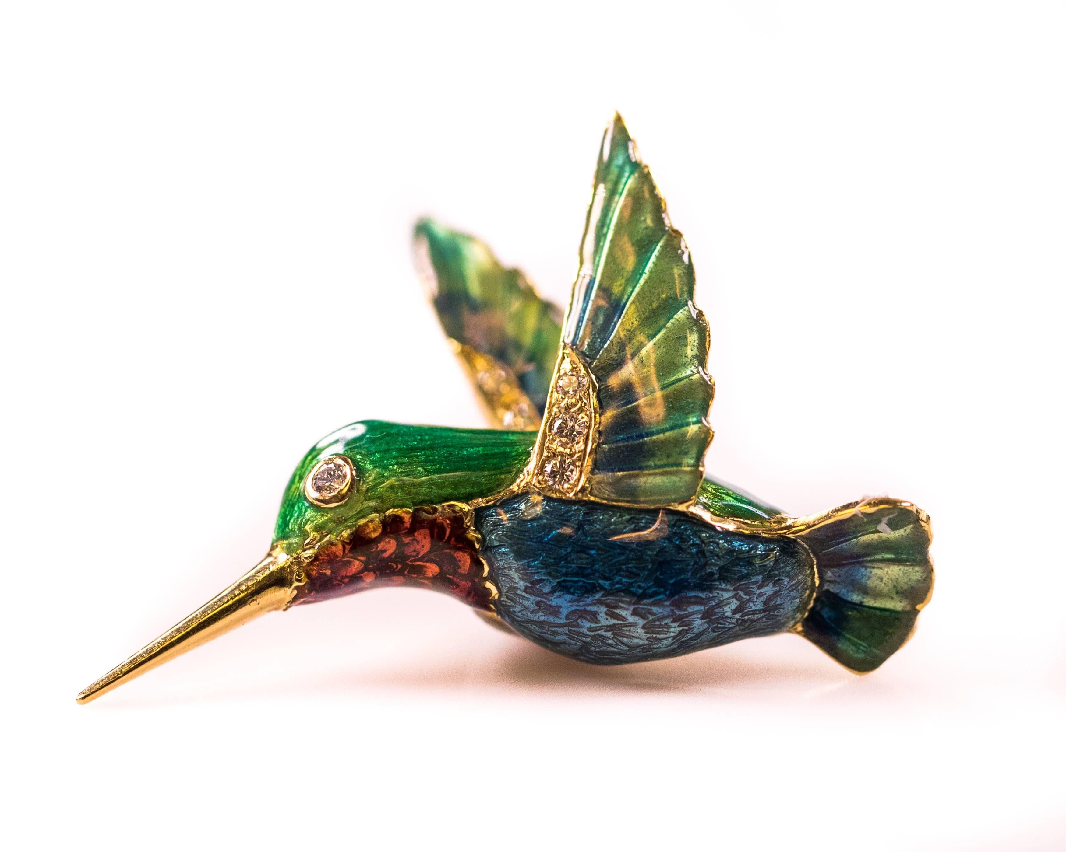 This Vibrantly Colored Hummingbird Pendant is sure to Enhance your Favorite necklace! Crafted from 18 Karat Yellow Gold, this vintage 1980s charm features 6 diamonds and exquisitely detailed, brightly colored enamelwork. The Hummingbird's head,