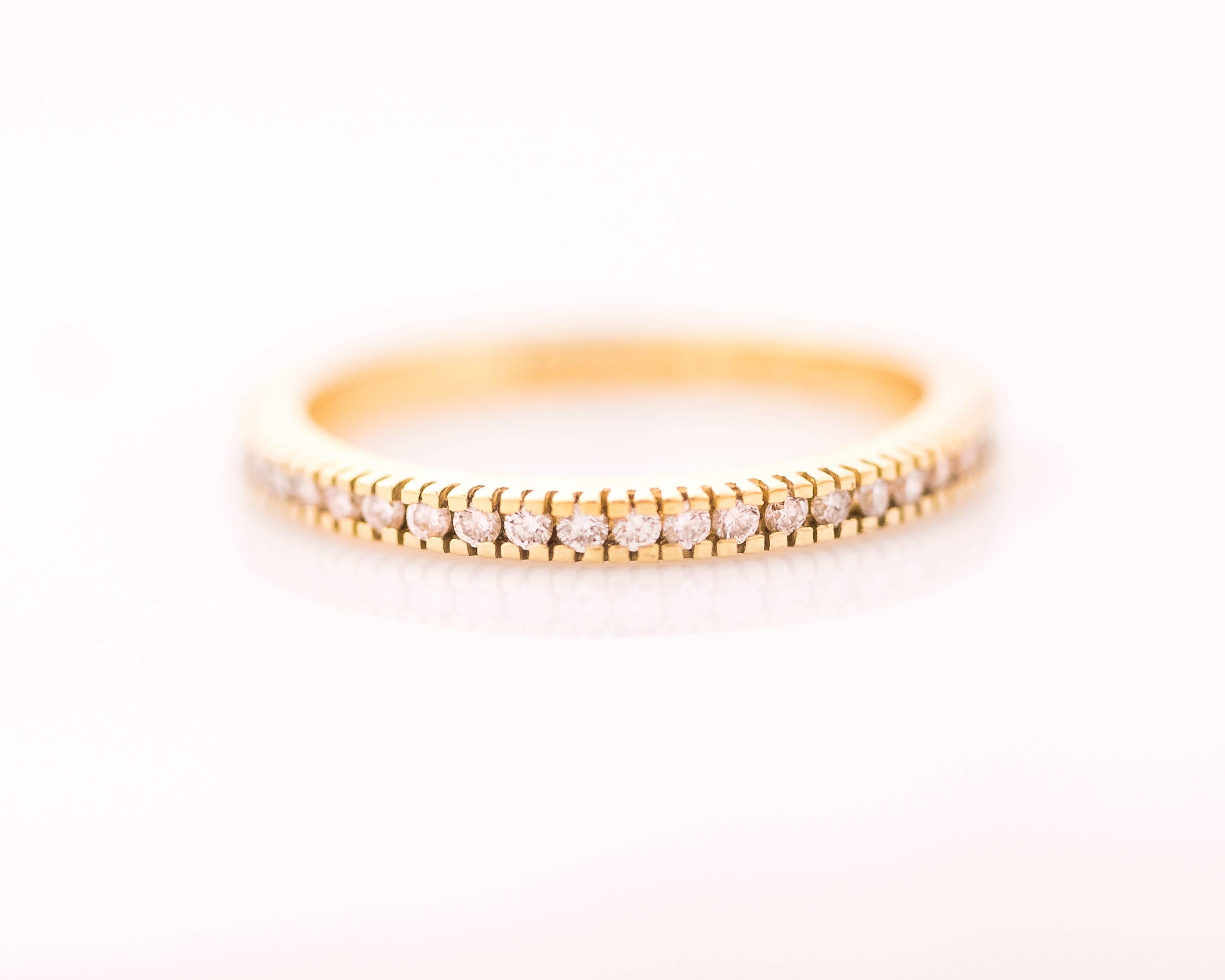  Wear this gorgeous 1990s Designer Hidalgo Diamond Eternity Band alone, Stacked or as a Wedding Band. It features .30 Carats of prong set round brilliant Diamonds set in 18 Karat Yellow Gold along the front half of the shank. The back half of the