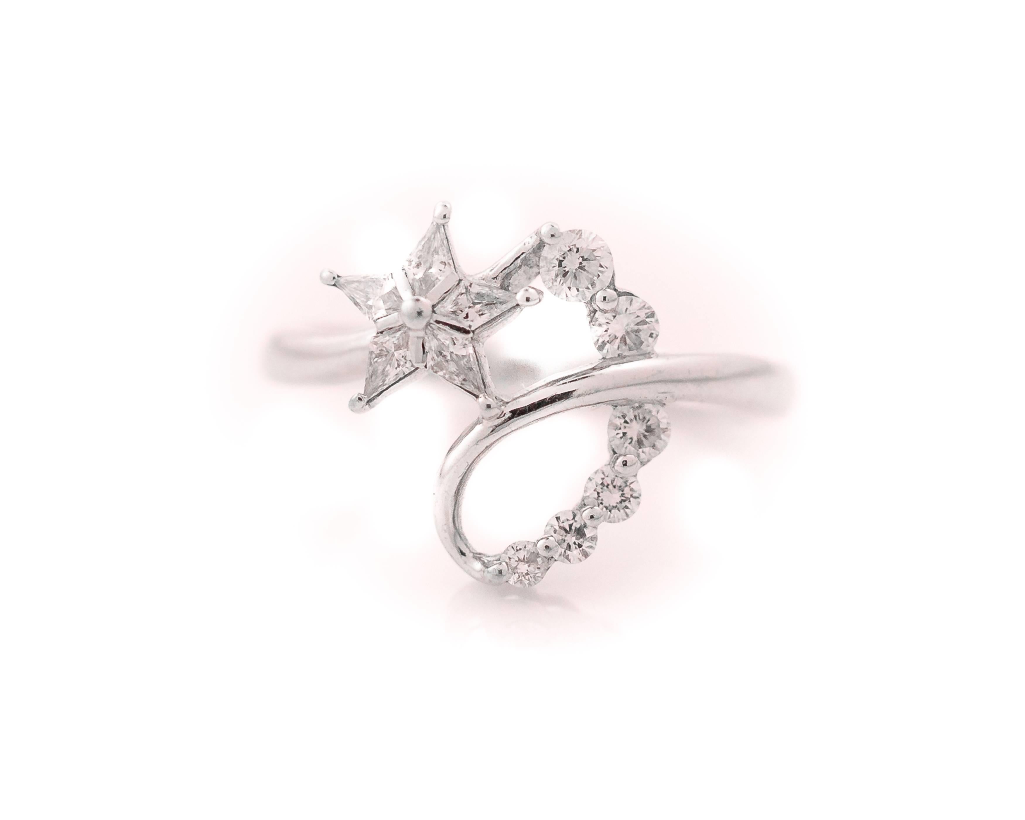 This 1990s Diamond Shooting Star Cocktail Ring is a very Fun Statement piece! It features .50 Carats of Diamonds set in 18 Karat White Gold. Five Custom cut Diamonds form the Star while Six Round Brilliant Diamonds form the Dazzling Tail of the Star
