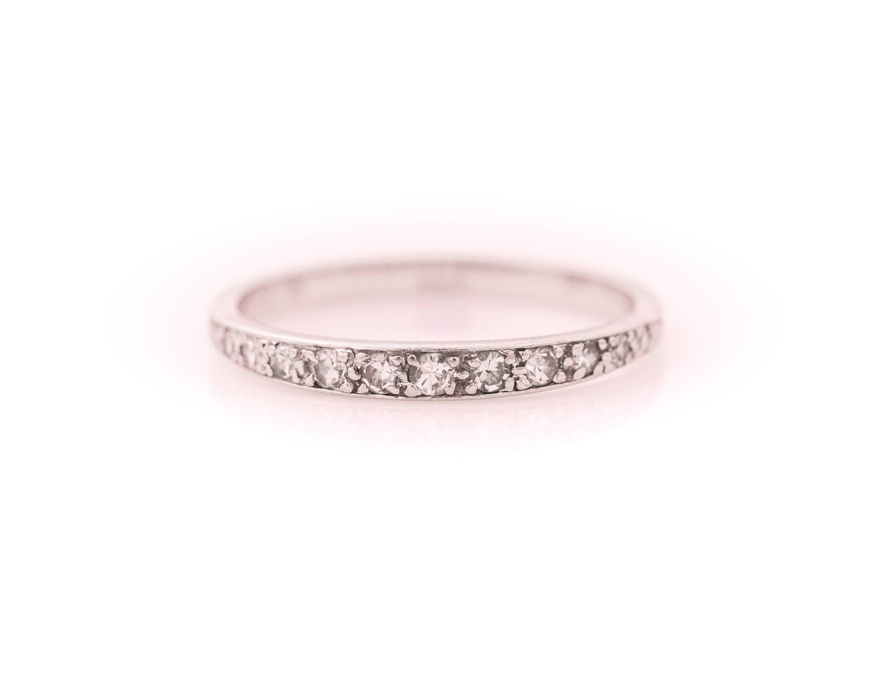 1920s Art Deco Diamond and Platinum Eternity Band. Features .15 carats of prong set Single Cut Diamonds set in Platinum. The diamonds embellish the front half of the ring shank while the back half of the shank is smooth Platinum. The front half of