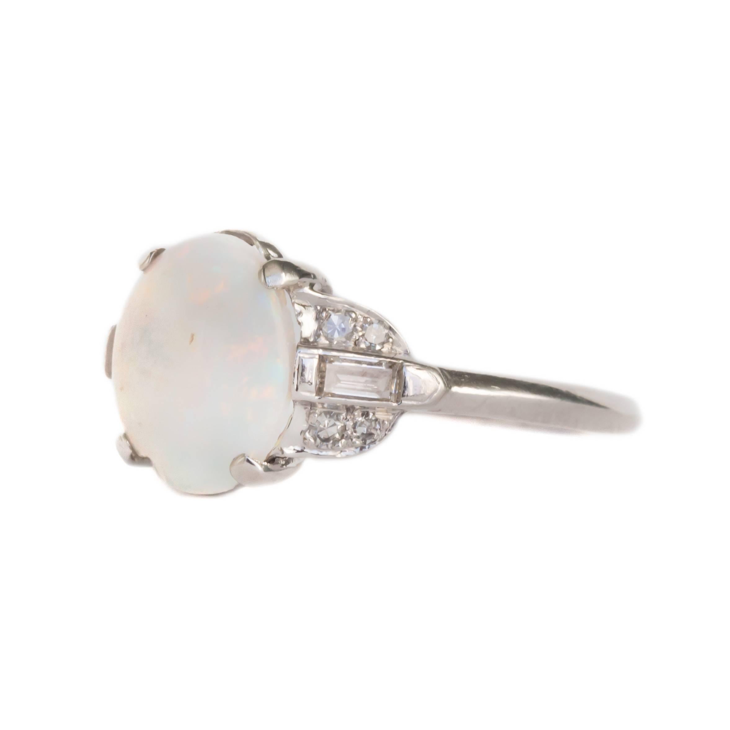 Item Details: 
Ring Size: Approximately 5.50
Metal Type: Platinum
Weight: 2.6 grams

Color Stone Details: 
Type: Opal
Shape: Oval
Carat Weight: 1.50 carat
Color: Mixed Color Play Over White

Side Stone Details: 
Shape: Antique Single Cut and
