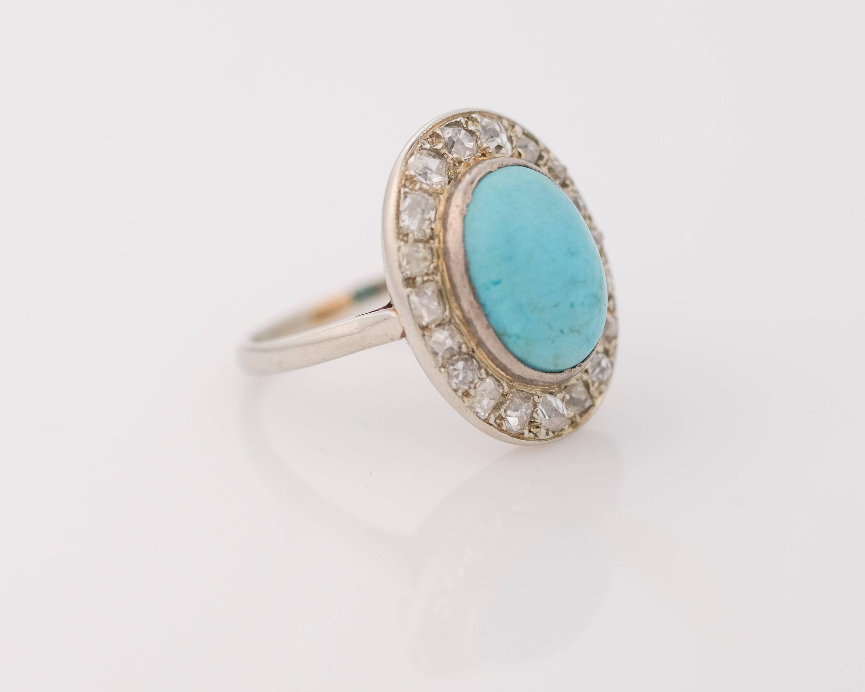 Hello Lovely! This angelic ring features a 0.5 carat total halo of Old Miner cut diamonds surrounding a beautiful blue turquoise oval cabochon. These beautiful gems are set in 14 karat white gold. 
The turquoise cabochon measures 12 mm long x 9mm