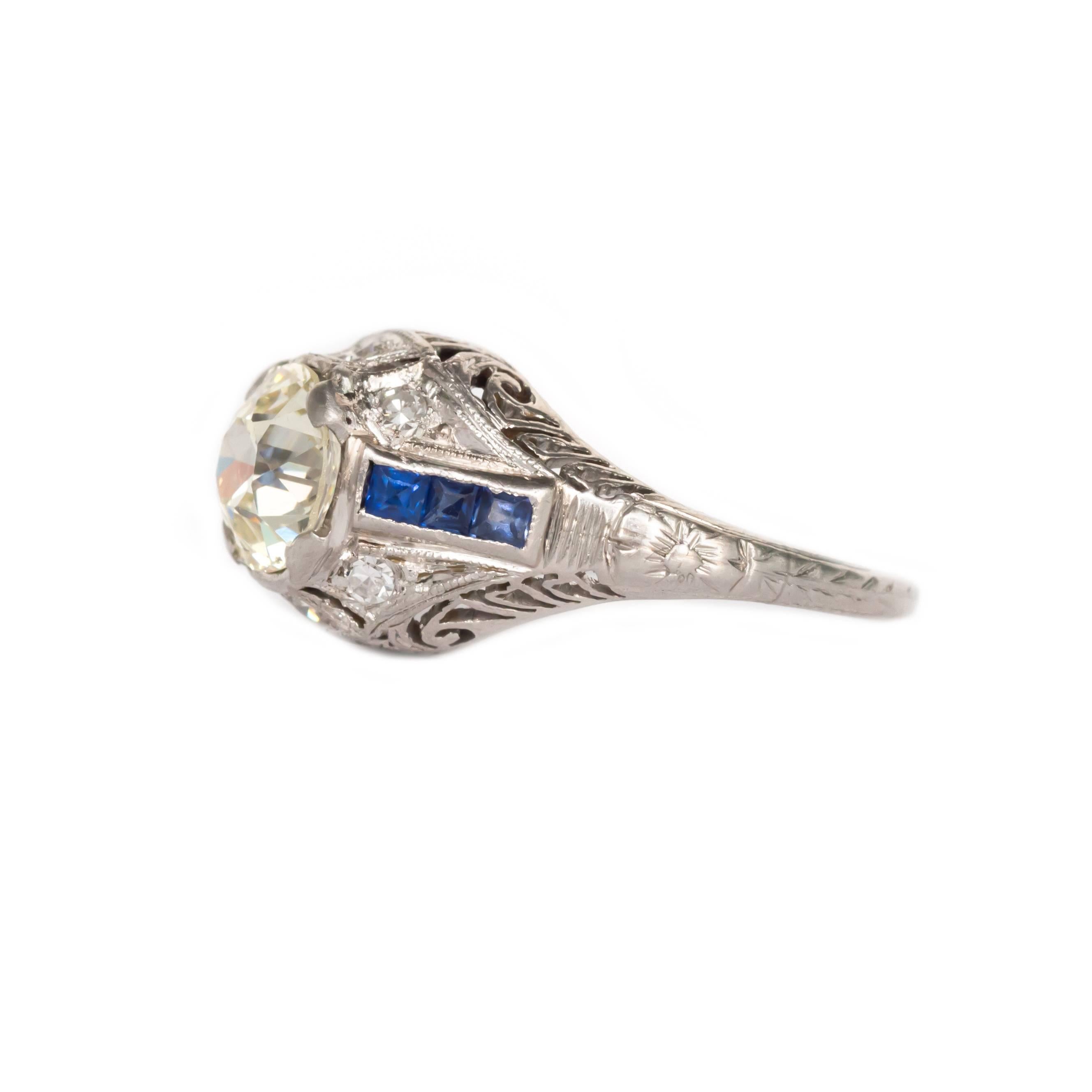 Item Details: 
Ring Size: 4.5
Metal Type: Platinum
Weight: 3.9 grams

Center Diamond Details:
Shape: Old European Brilliant
Carat Weight: 1.24 carat
Color: M
Clarity: VS1

Side Stone Details: 
Shape: Antique Single Cut
Total Carat Weight: .08 carat,