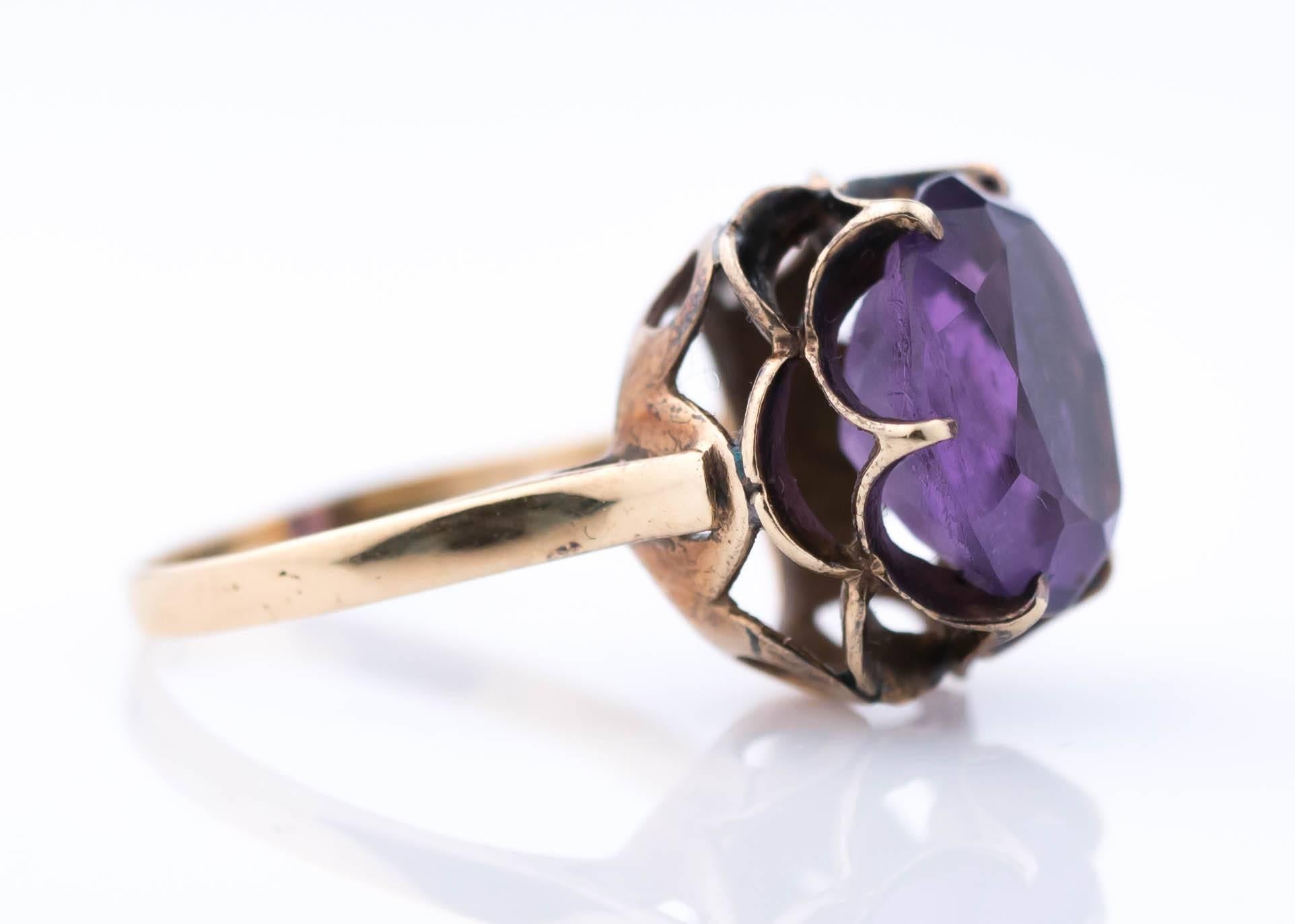1930s Art Deco Amethyst and 14 Karat Yellow Gold Ring
Features a Cathedral Setting with a Floral Gallery. The setting appears to form small petals behind the center stone. 
The Oval, medium Purple Amethyst is securely set with 6 prongs. 

The