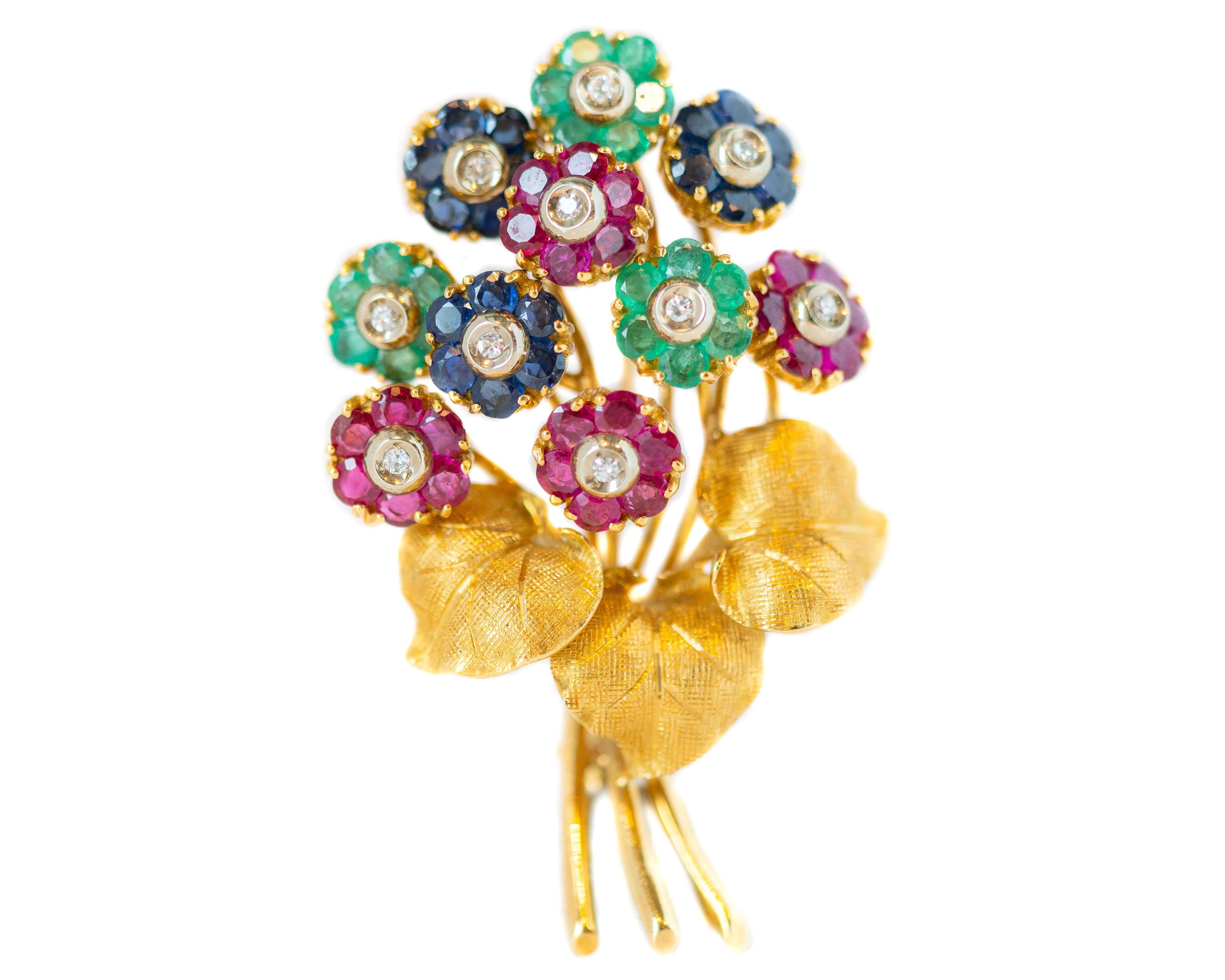 1950s Tiffany and Co. Floral Brooch Pin - 18 Karat Yellow Gold, Rubies, Emeralds, Sapphires, Diamonds

Features:
Collectible Vintage Design
Made in Italy
18 Karat Yellow Gold
5.0 carat total Gemstones
Diamonds, Emeralds, Sapphires, Rubies
Floral