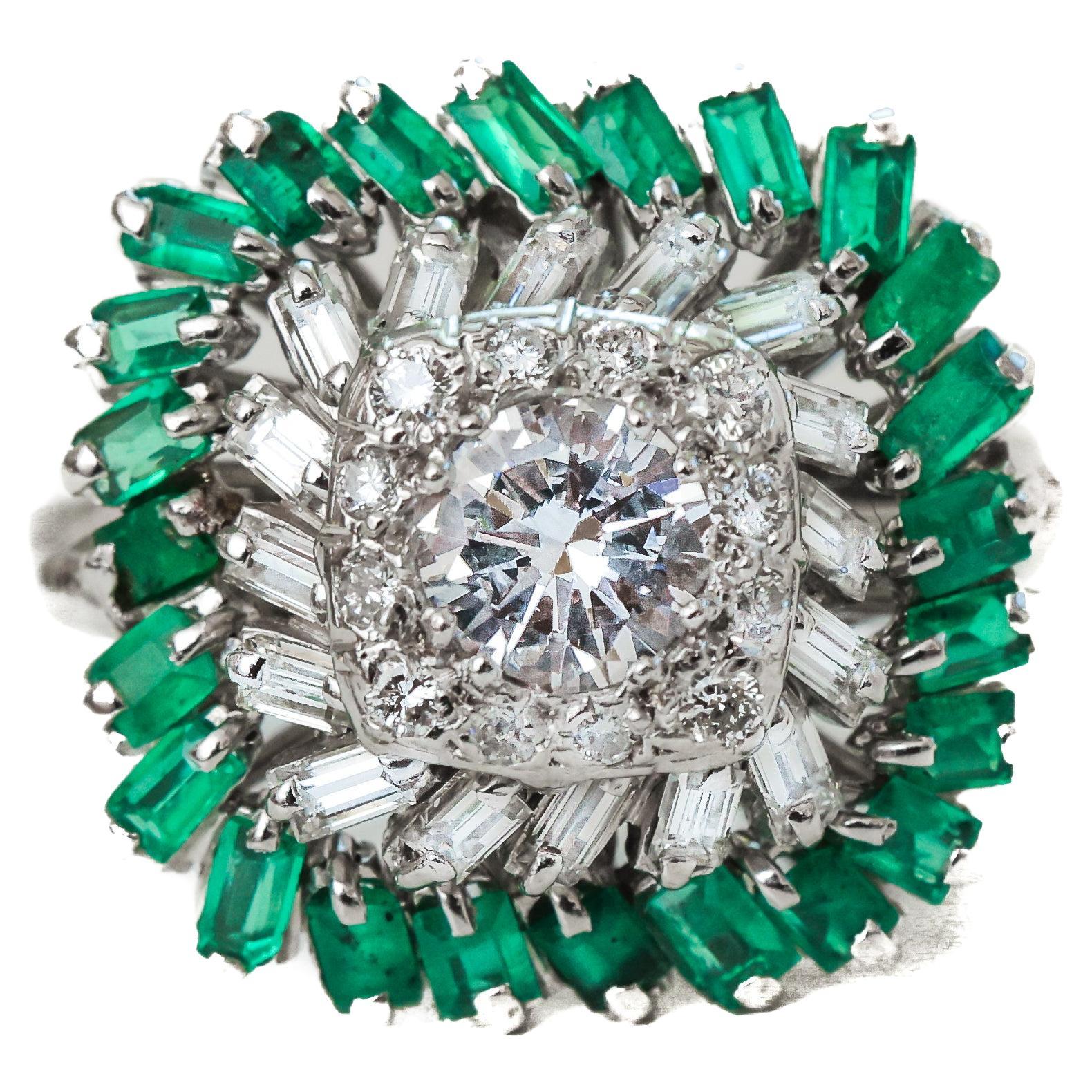Item Details:
Metal Type: Platinum
Weight: 8.4 grams
Ring Size: 8.5 (resizable)

Emerald Details:
Carat: .50 Carat

Diamond Details:
Cut: Round (center and accent) + Baguettes (accent)
Carat: 1 Carat Total
Color: L
Clarity: VS

1950s Platinum