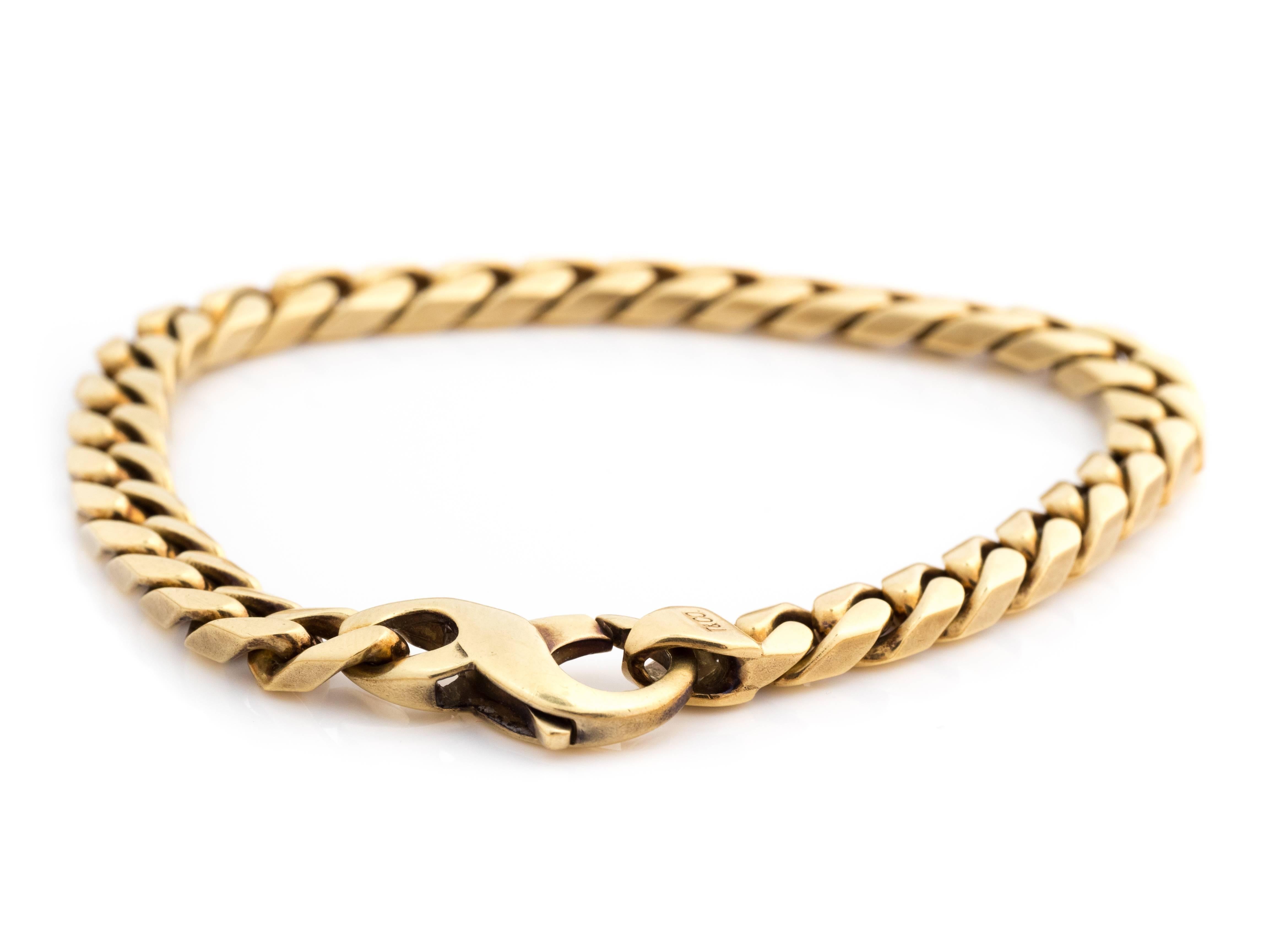 Tiffany and Co 18 Karat Yellow Gold Italian Curb Chain Bracelet. 

Features a Lobster Claw Clasp for extra wearing security. Hallmarks include Tiffany and Co., 750 and ITALY. Measures 8 inches long, can be sized down.

Solid, sturdy, smooth and