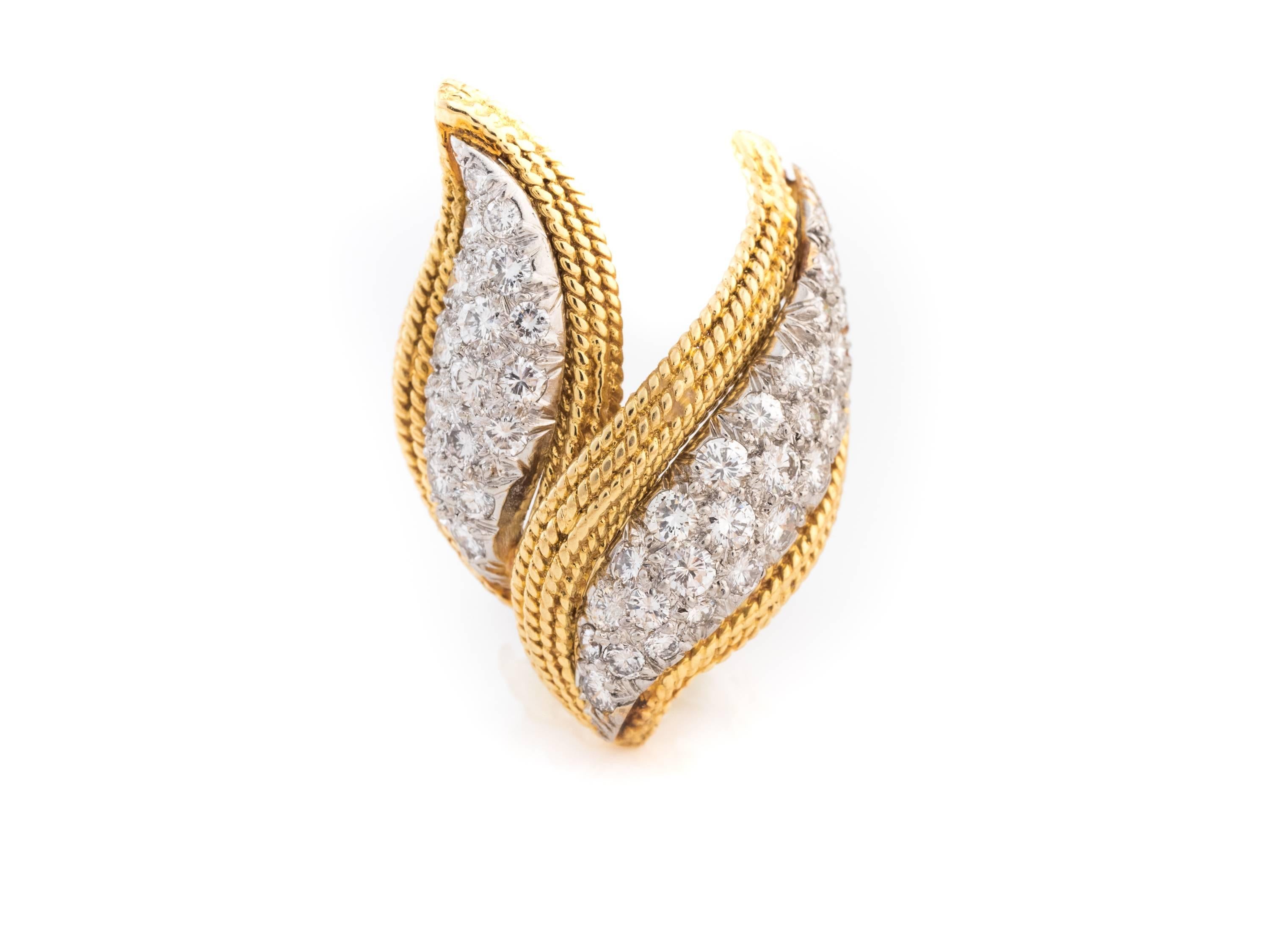 Double-Leaf motif diamond & 18kt yellow gold earrings. These Earrings have white gold centers where all the diamonds are set. Total diamond weight is 3.80 carats, and all diamonds boast G color and VS clarity. The outer yellow gold edge has an