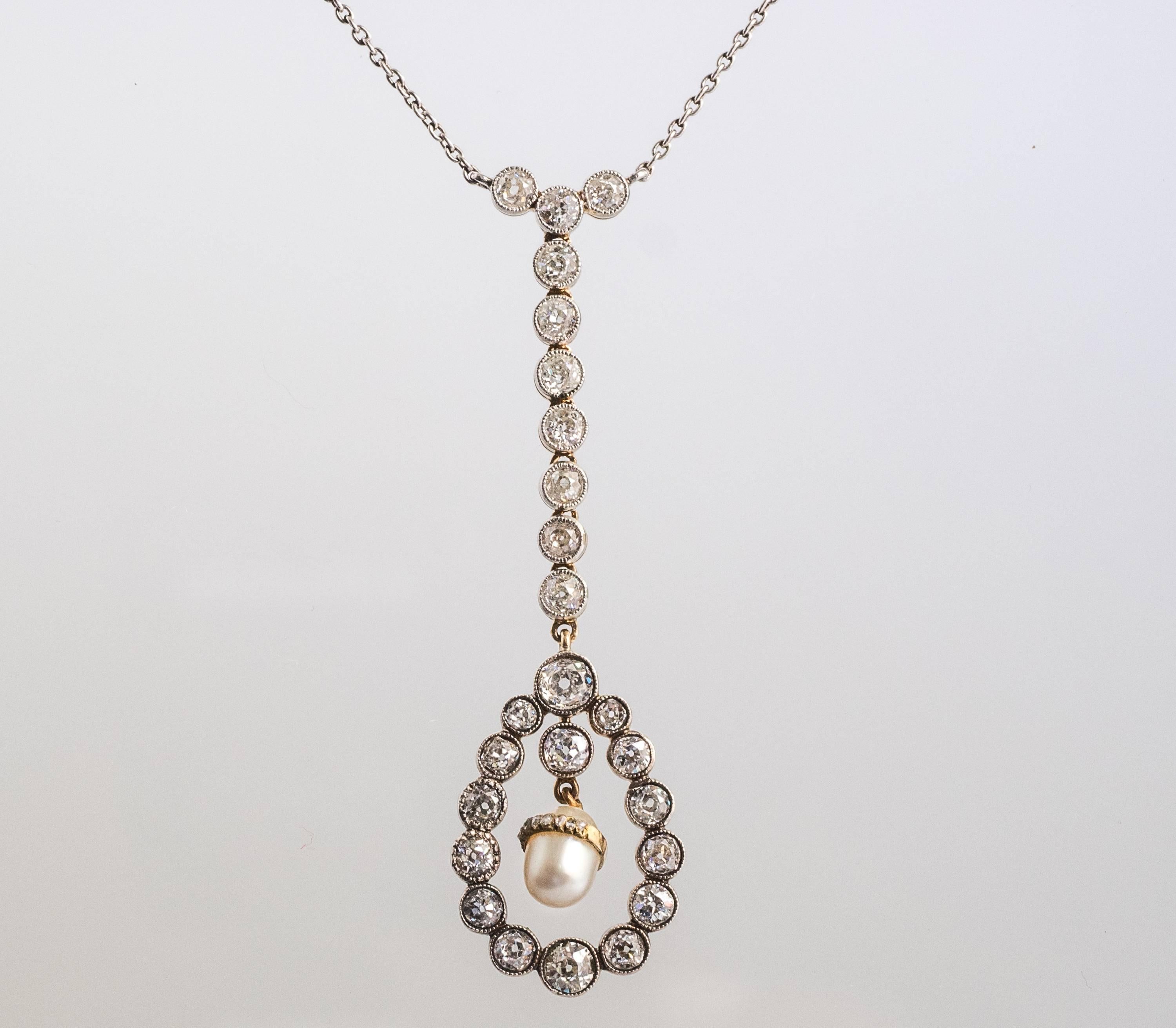 Art Deco Diamond Pearl and 14 Karat Two-Tone Gold Drop Necklace. Very early Art Deco/Victorian necklace with old miner diamonds and an oval egg shaped pearl. All diamonds on the drop are old mine cuts and range from G-I Color and VS-SI clarity. The