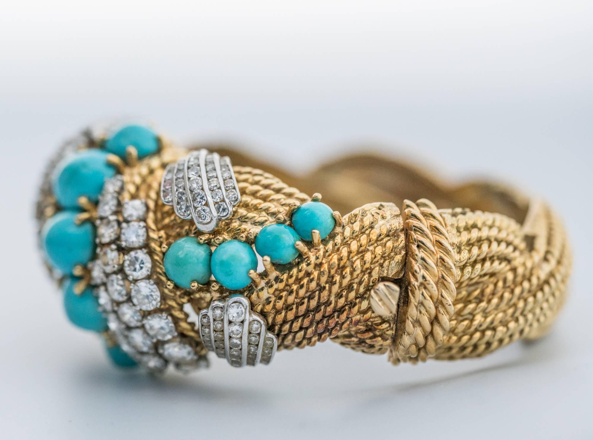 Bold statement bangle from the 1950s, perfect Retro example use of Persian Turquoise and Transitional Cut Diamonds. All Diamonds boast G-H in color and VS-SI1 in clarity. The pattern is a weave of braided gold strands weighing in at 117.9 grams of