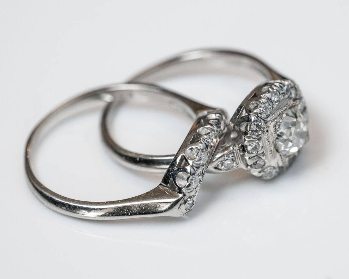 Beautiful one-of-a-kind complete bridal wedding set. Dates back to 1920s. Recently acquired during an estate sale. Engagement ring features center diamond, GIA certified, 0.53 carat, J color VS2 clarity. Additional accent diamonds visible around
