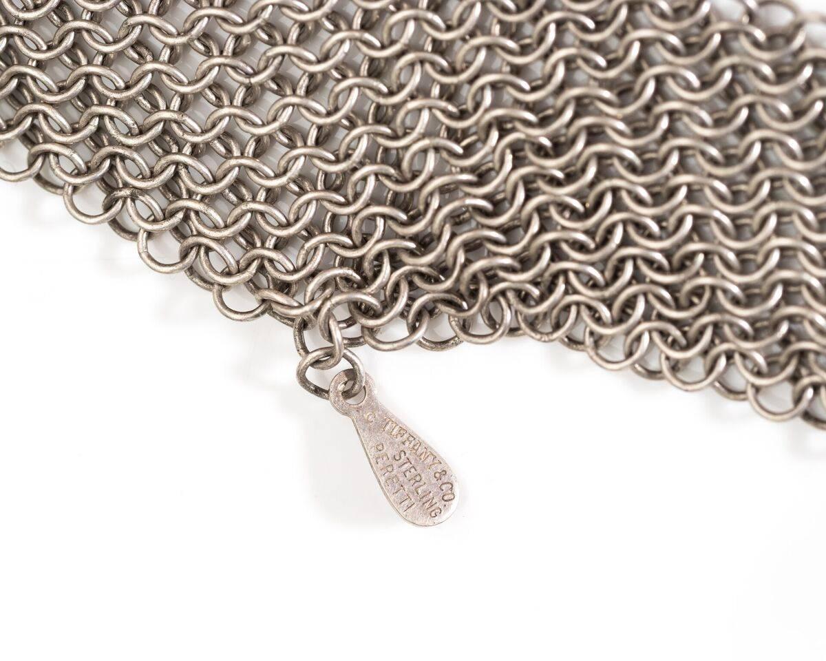Tiffany & Co. Mesh Tie Scarf / Necklace
Elsa Peretti Collection
Features Chain Link Design Throughout
142.1 grams total, Sterling Silver (hallmarked)
Rare and Unique
48 Inches Length
One Inch Width
Multipurpose 