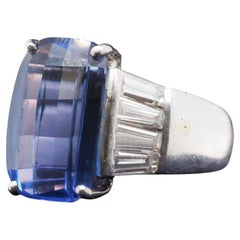 Anillo de tanzanita y diamante baguette en platino con facetas en damero