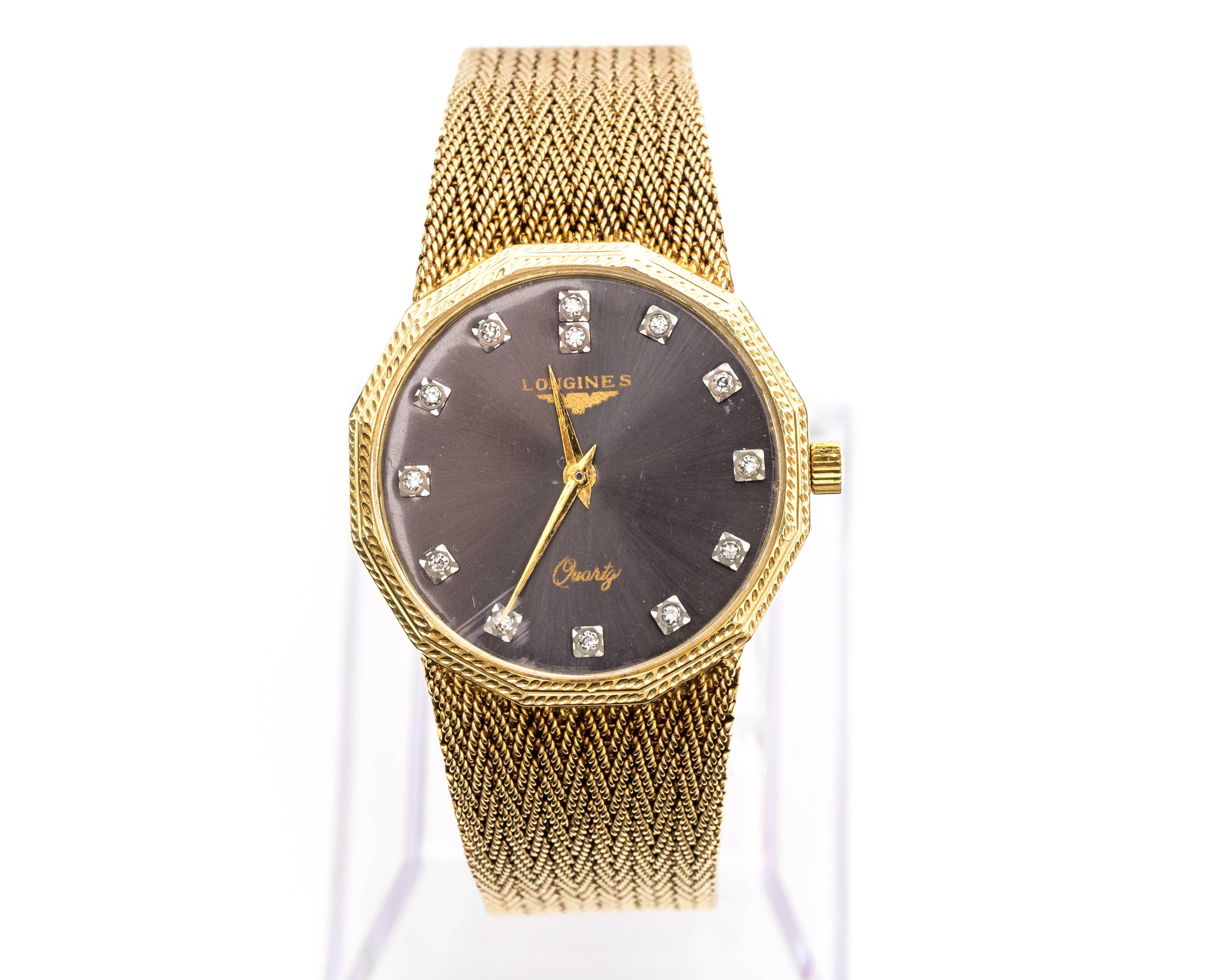 Beautiful 1960s Longines Designer Quartz Wristwatch
Crated in 14 Karat Yellow Gold
Charcoal Grey Dial with Diamond Markers
Crystal has a slight rash at 7 p.m. mark. 
Bracelet is Mesh Woven Pattern Crafted in 14 Karat Yellow Gold that is attached at