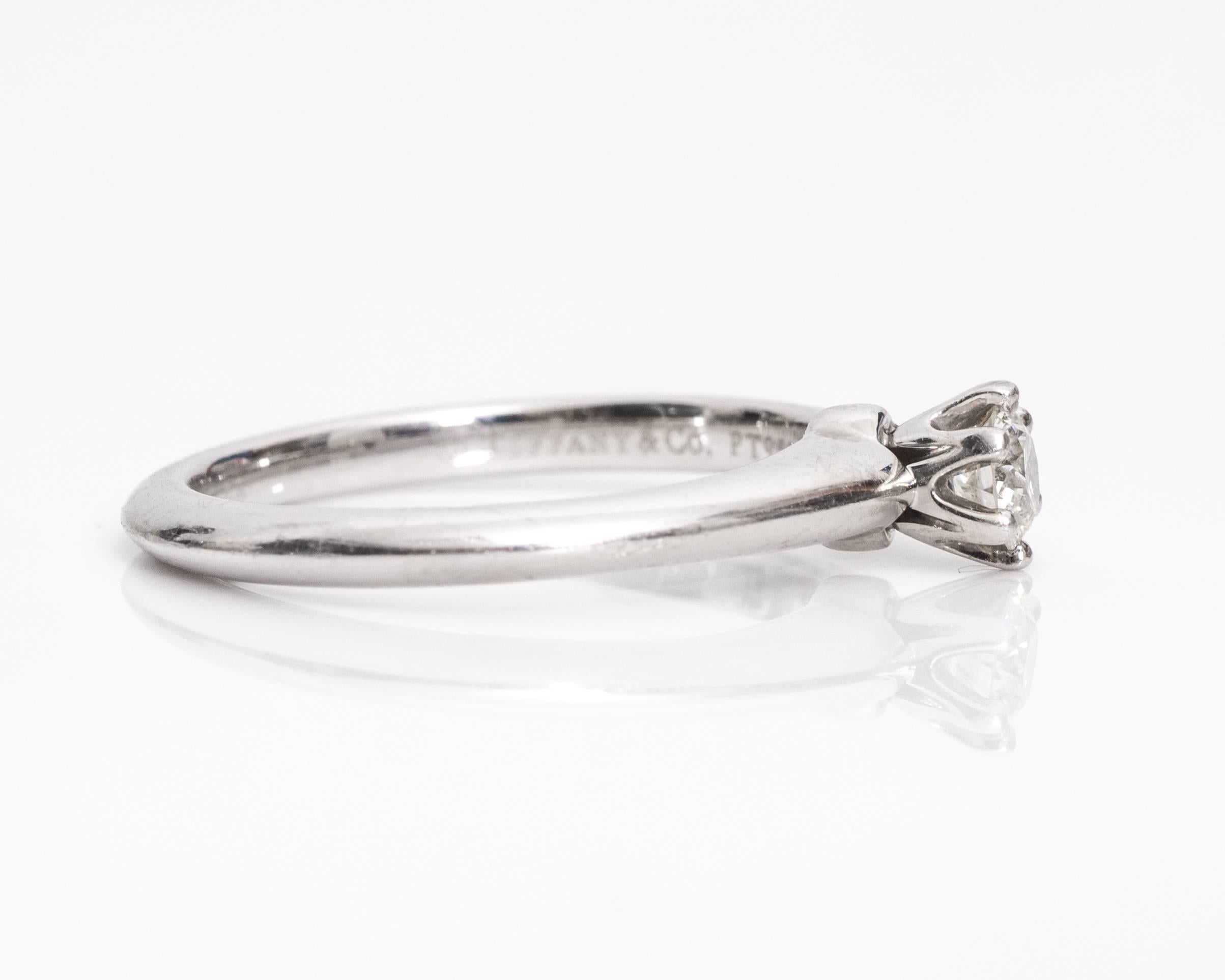 Gorgeous Tiffany & Co Platinum Solitaire Ring
1990s
Features 0.19 carats of Diamonds, F color and VVS clarity, Round Brilliant Cut
Set in classic 6 prong setting
Hallmarked PLATINUM and TIFFANY & CO
Fits Ring Size 5.5 and can be resized  
