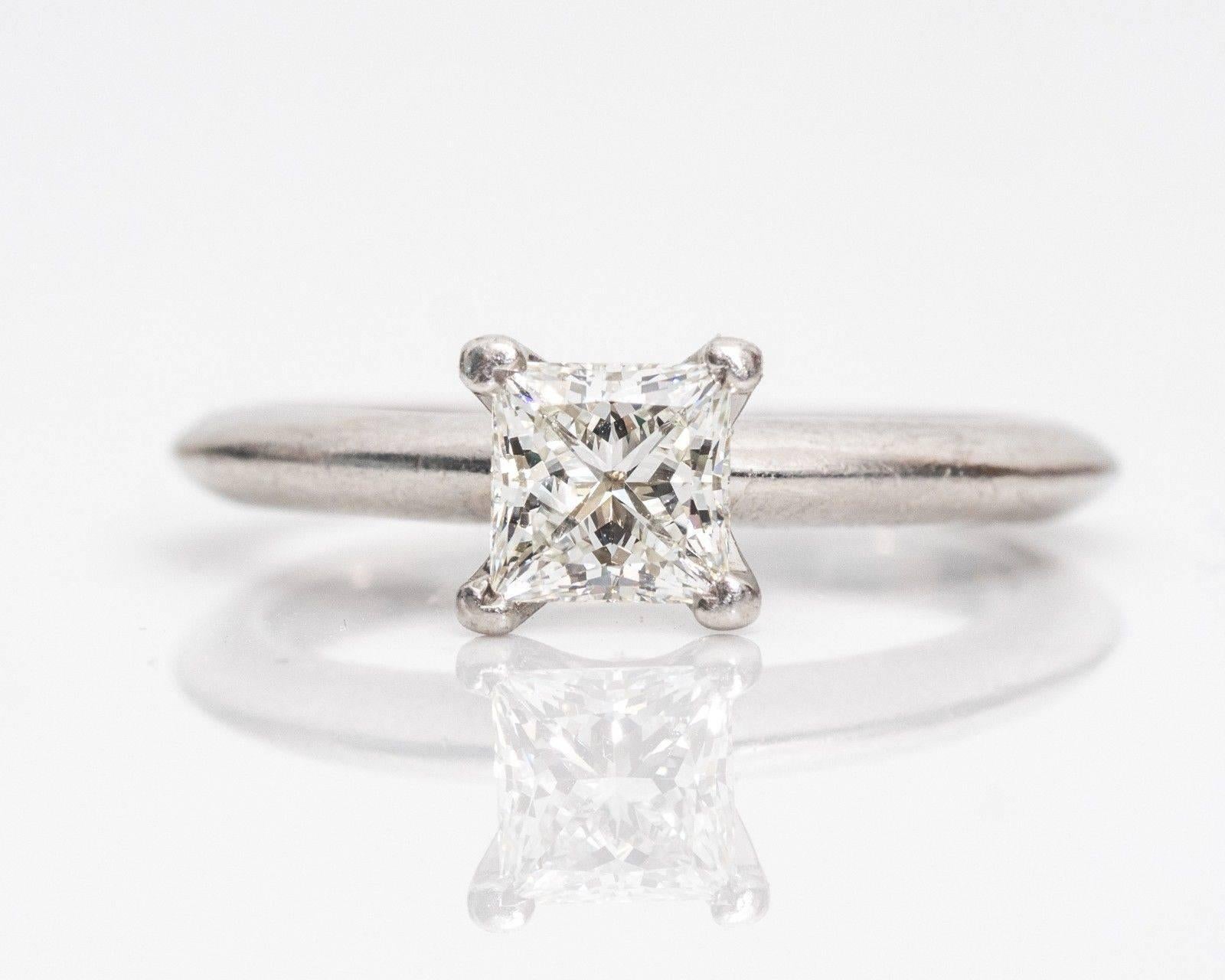 If it's true that simplicity is sophisticated, then this ring embodies elegance at its finest! The ring combines a princess cut shape but with the sparkle of a round brilliant stone. The square modified brilliant diamond with an excellent cut