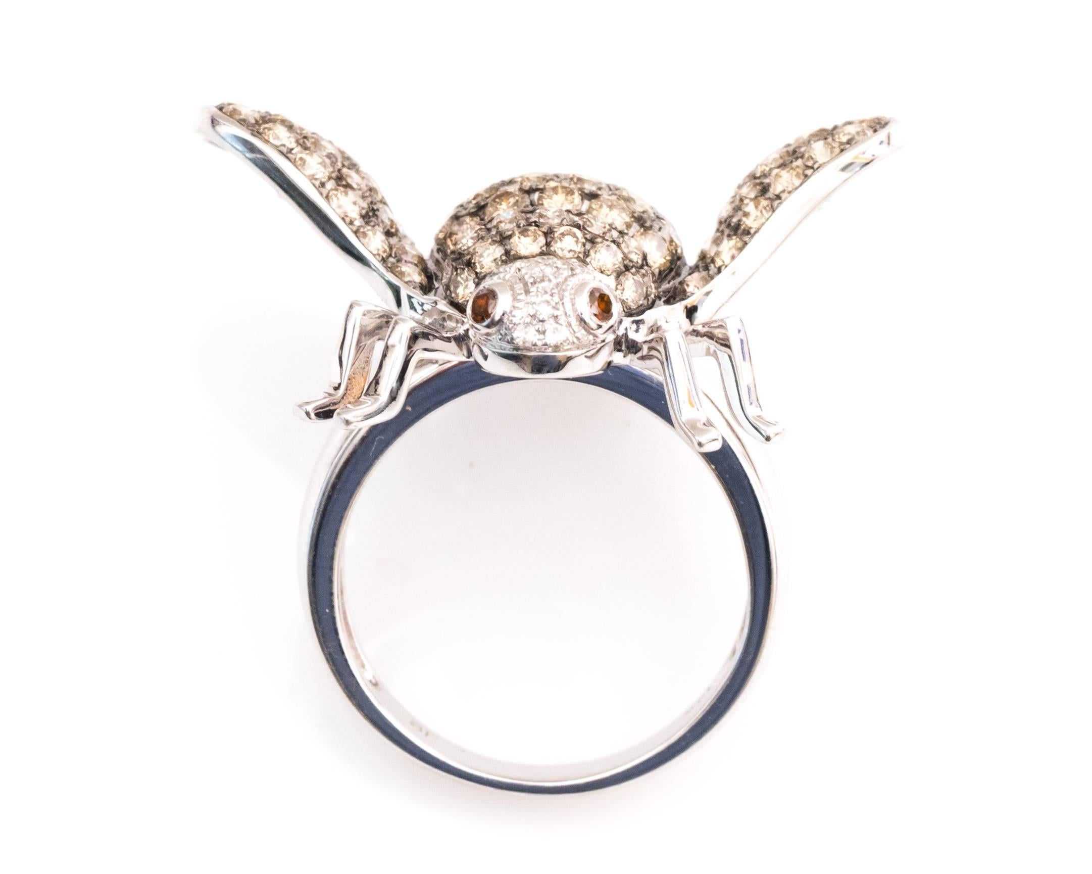 Absolutely stunning handcrafted 14 Karat white gold cocktail ring with a large bee design.

Diamond Details:
Cut - Round Brilliant 
Cut - 1.2 carats total weight
Color - White, Champagne, Orange/Chocolate
Clarity - VS-SI

Fits ring size 5 and can be