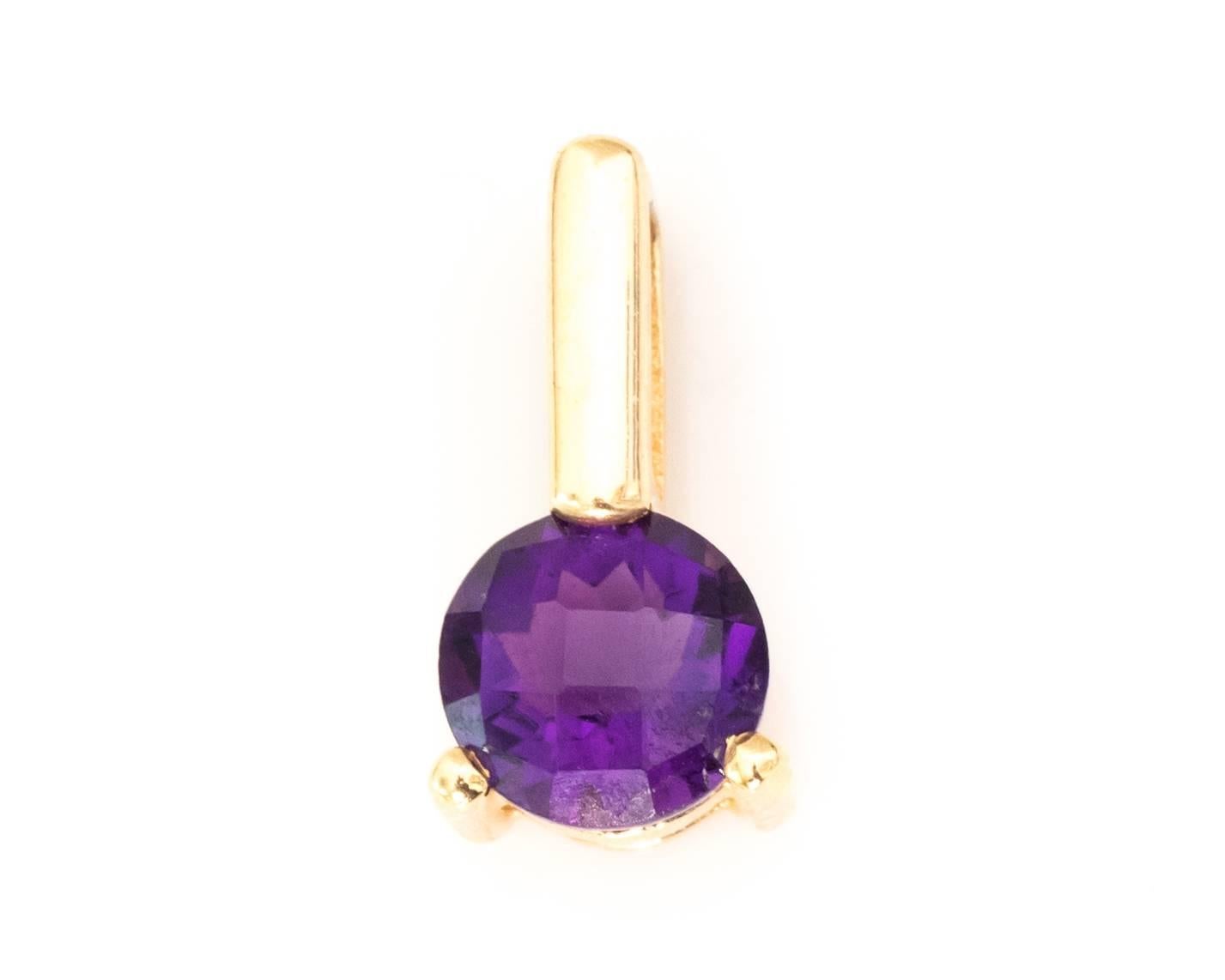 Custom Made Charm from the 1950s
Features a Gorgeous Purple Amethyst in the center of the pendant
Amethyst has a checkered board cut pattern on it's round frame with a lovely deep purple hue. It is held by 2 prong's and a bail loop on top. 