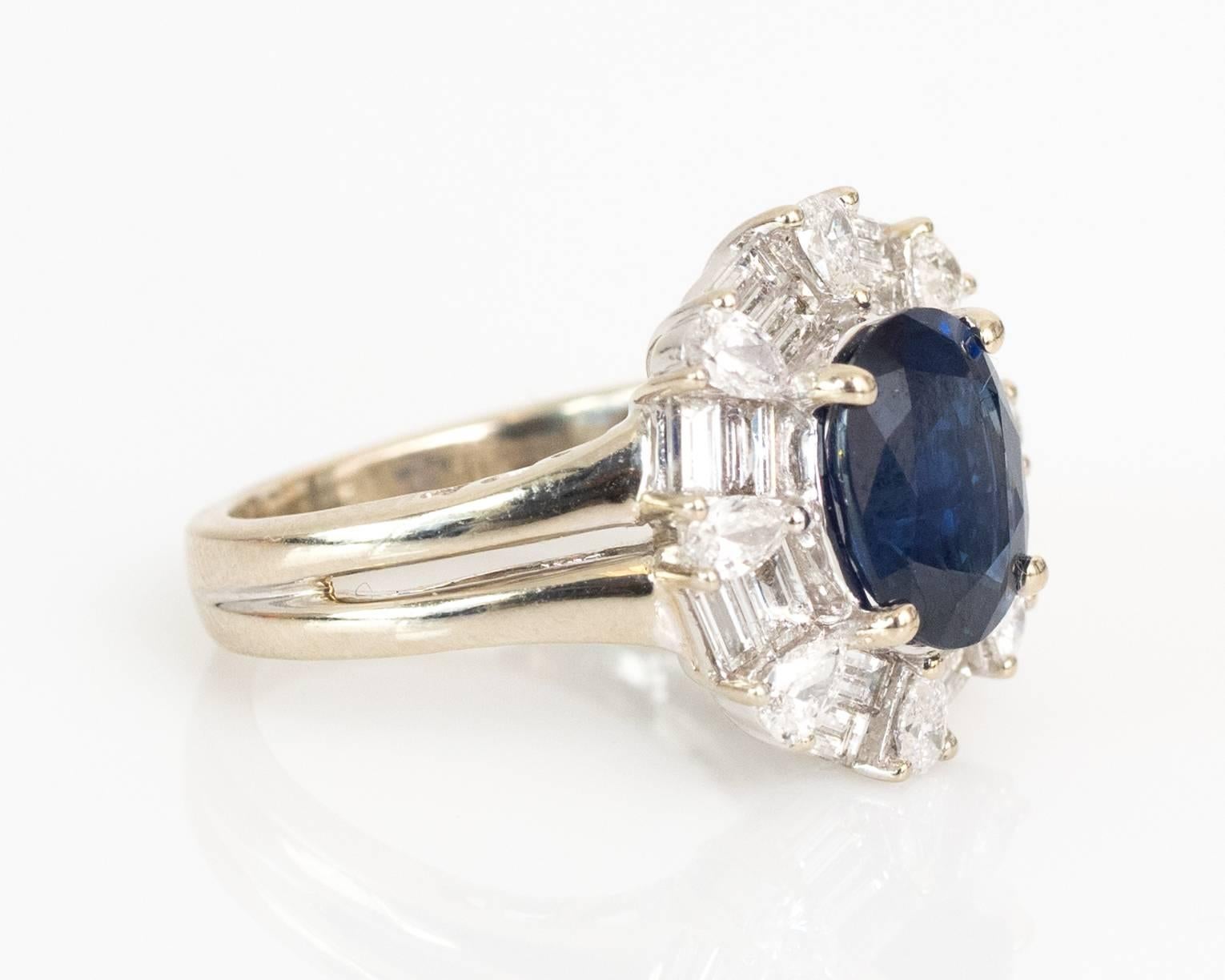 Item Details: 
Ring Size: 4
Metal Type: 14 Karat White Gold
Weight: 5.6 grams

Center Stone Details for Natural Blue Sapphire, GIA-Certified 
GIA Report # 5181586746
Cut: Oval Shape, Crown is Brilliant Cut and Pavillion is Step Cut
Measures: 9.03mm