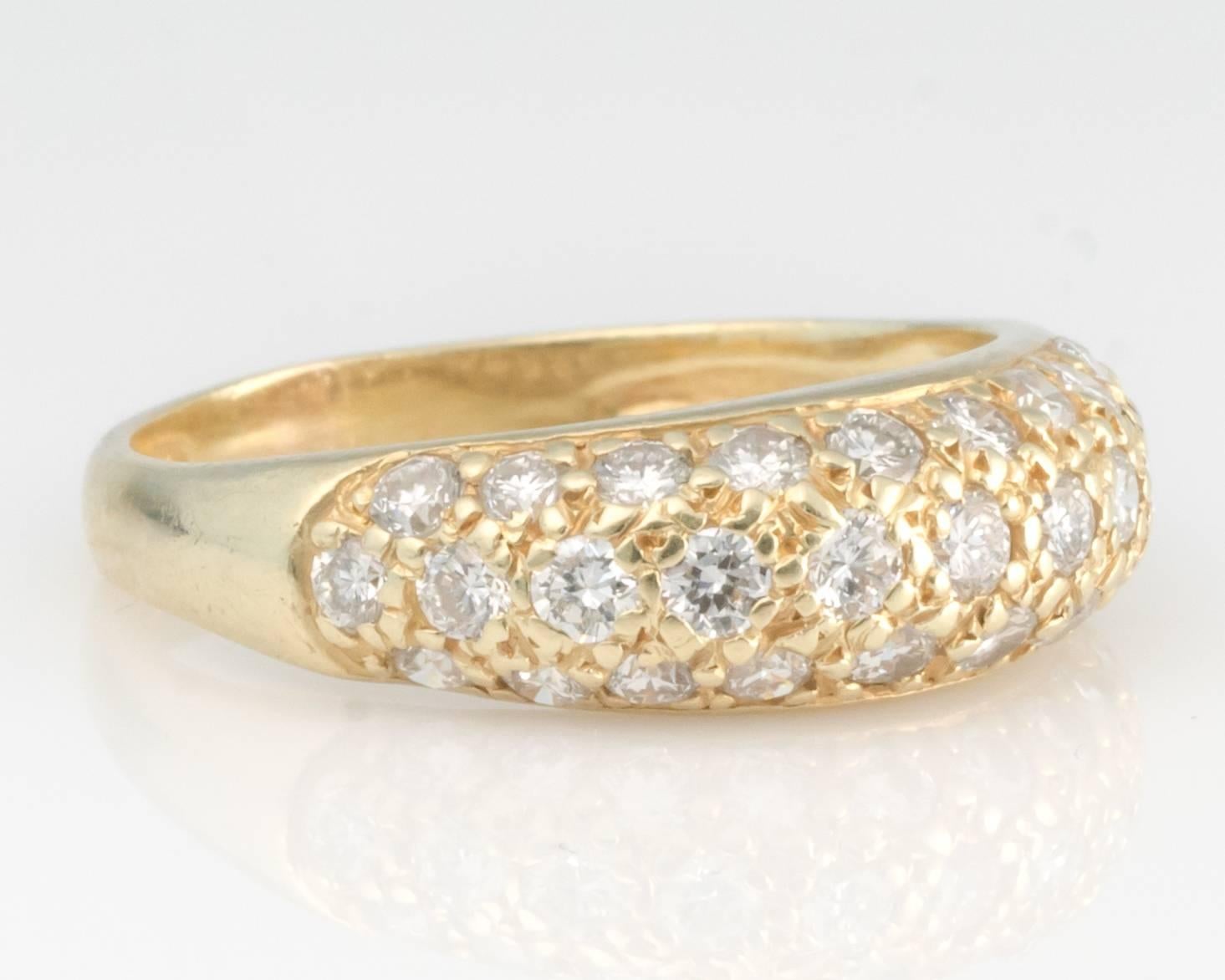 This elegant pave set 18 karat yellow gold dome ring will make a classic addition to anyone's jewelry collection. It can be worn as a wedding band or as an individual  ring. This stunning 3.46 gram total weight ring has .5 carats of diamonds.
