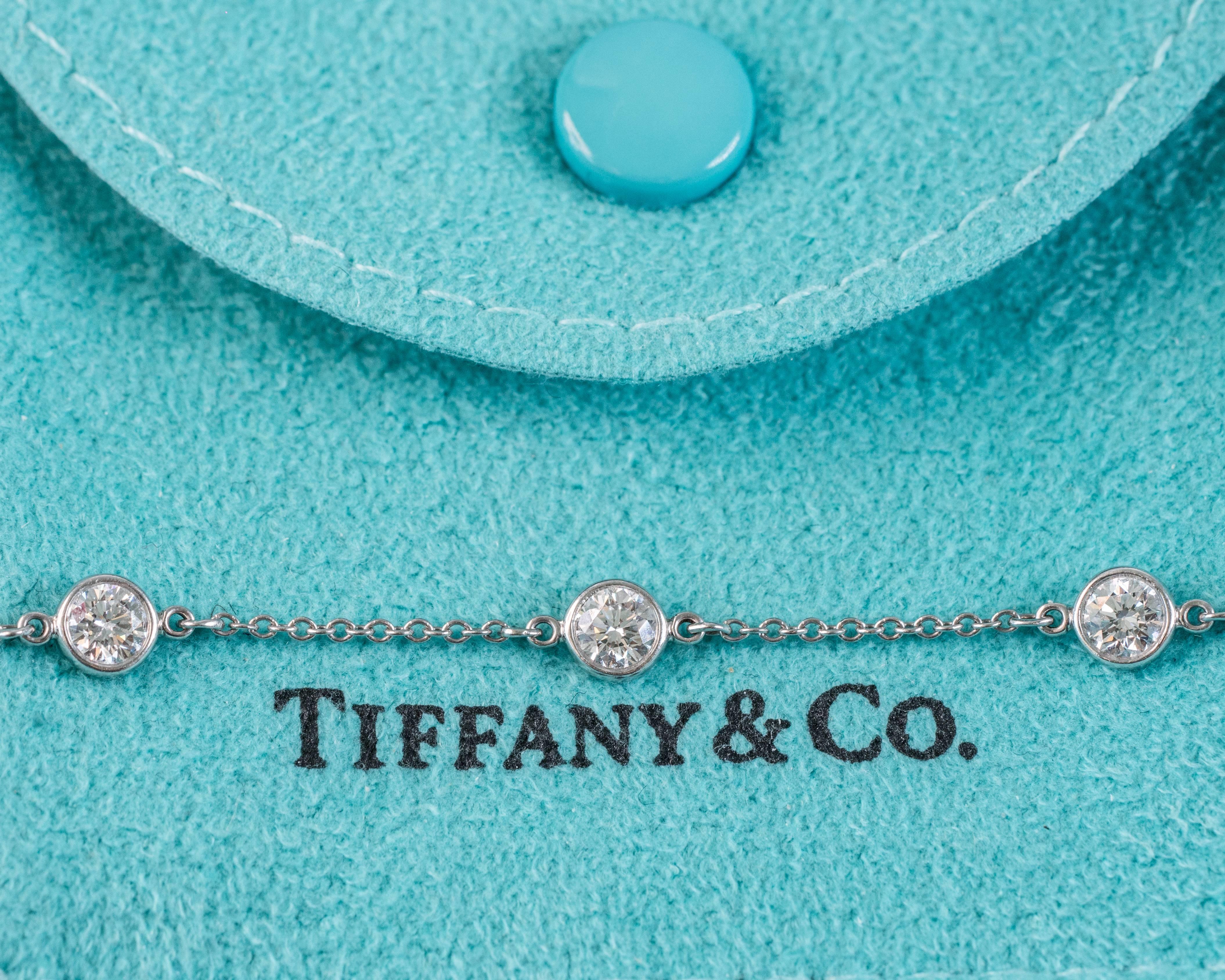 This Stunning Platinum and Diamond Tiffany and Co Elsa Peretti Diamonds by the Yard bracelet features 7 round brilliant diamonds bezel set in timeless platinum. The bracelet measures 7 inches long and comes with the Tiffany and Co. pouch and box.